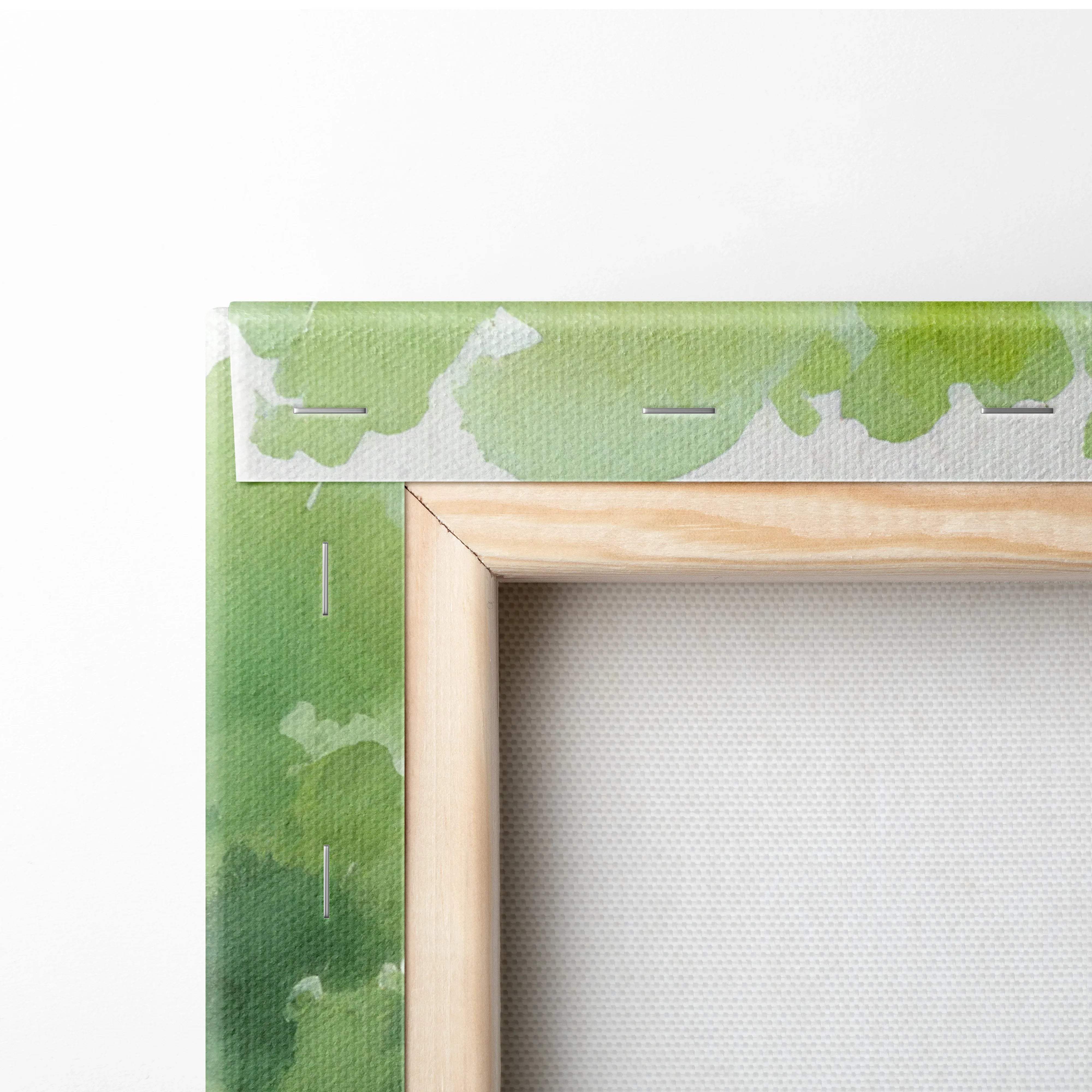 Back of light wood frame with sunlit watercolor cottage canvas, white tape top