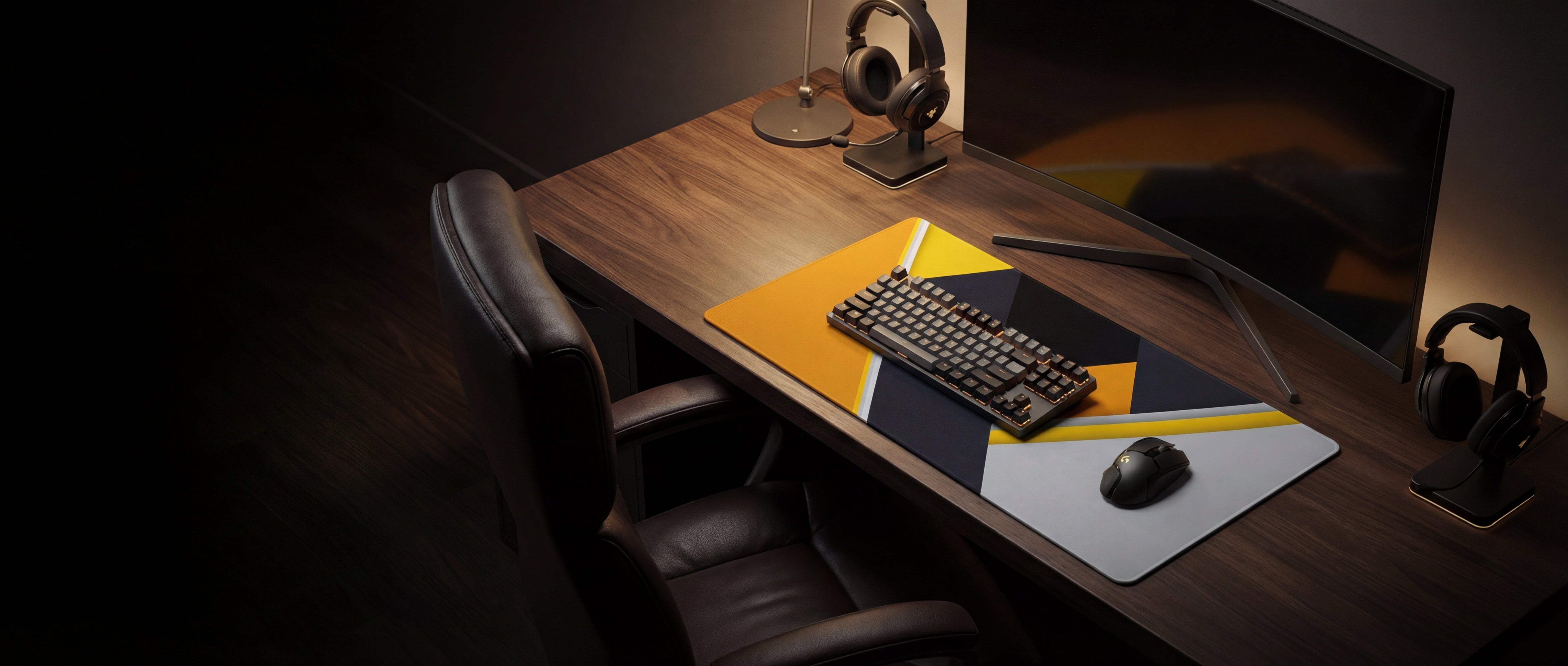 Black mechanical keyboard with a sleek, minimalist design resting on a vibrant yellow and black geometric mousepad.