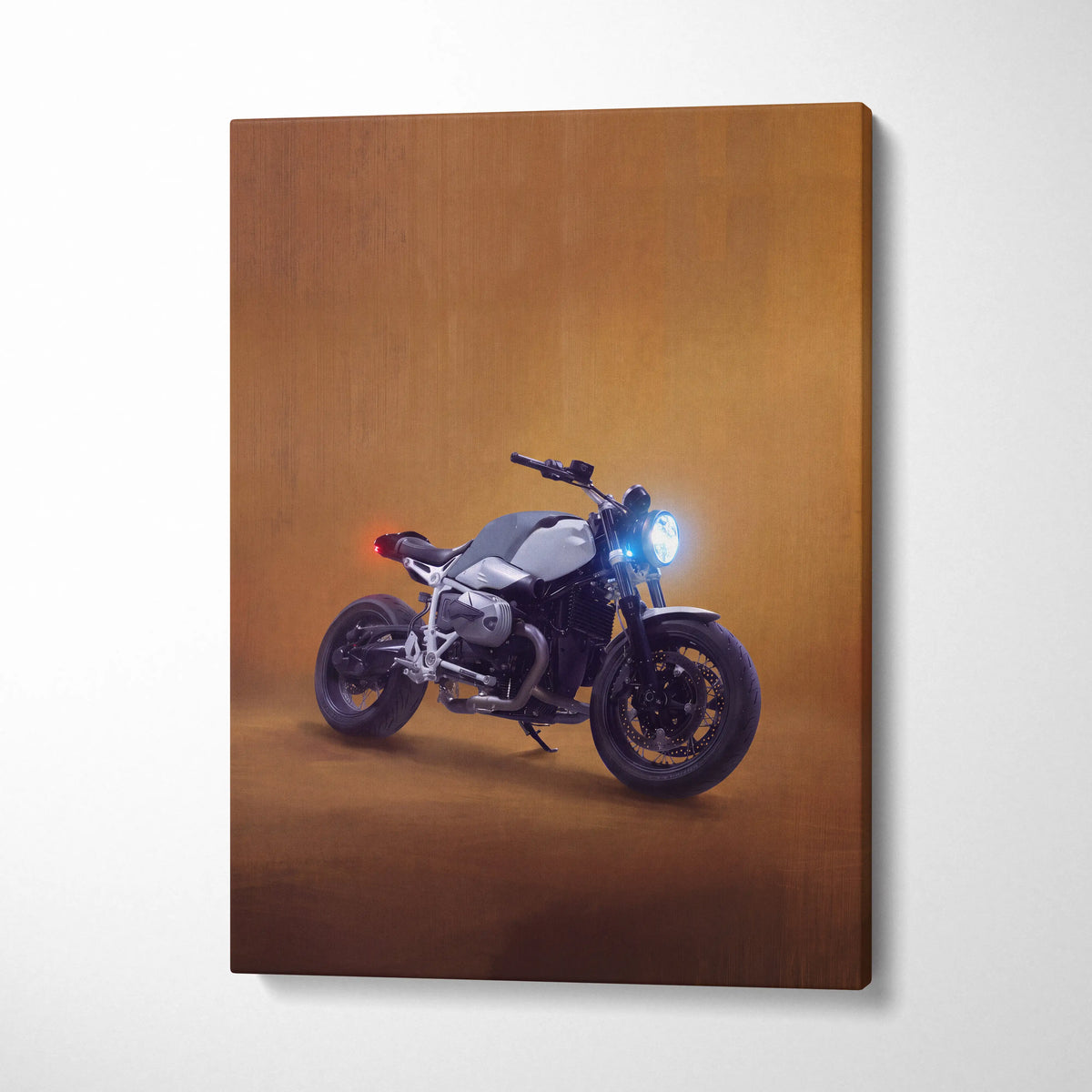 A sleek silver and black bmw r ninest inspired naked motorcycle canvas print with glowing blue headlight wall art