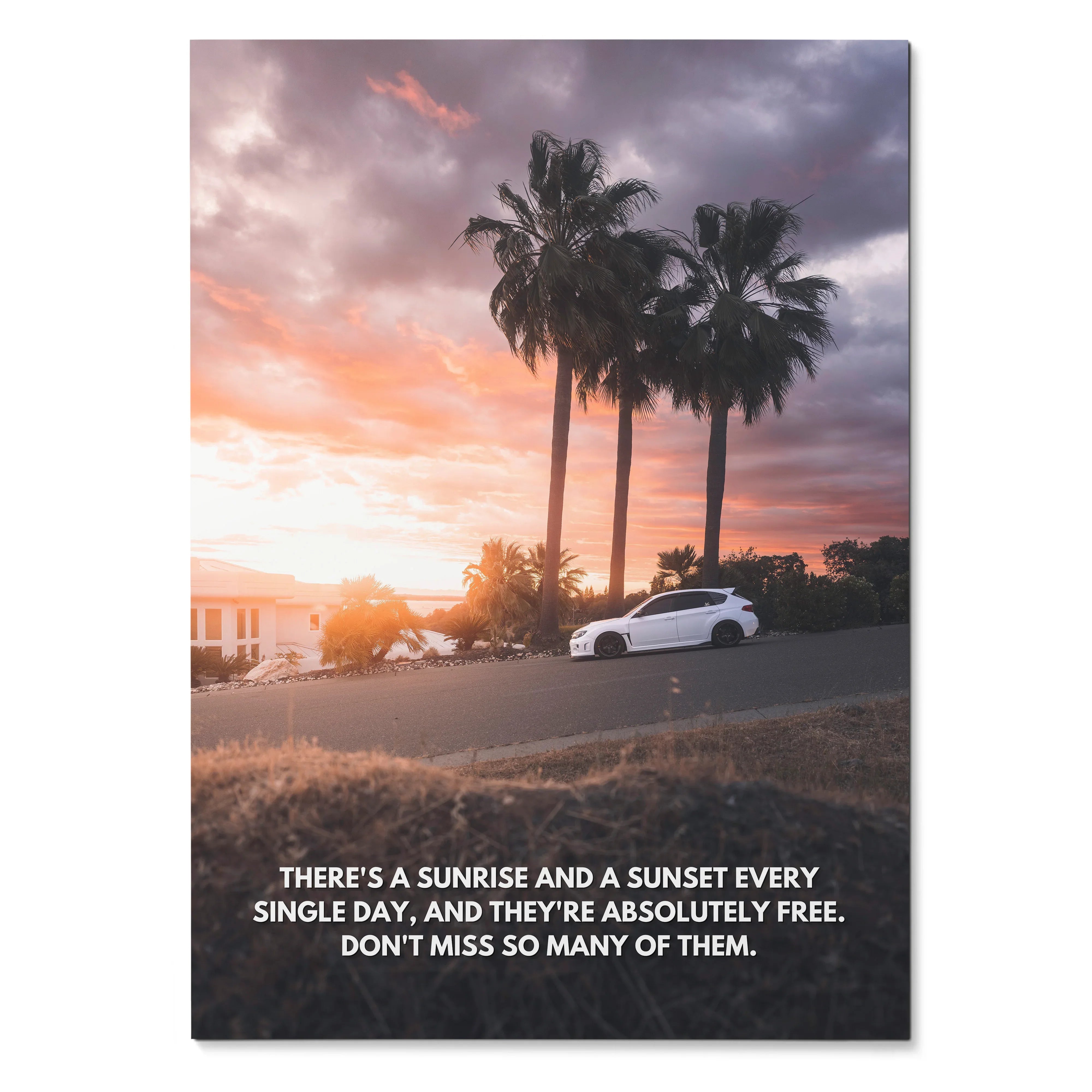 Motivational poster with a white Subaru WRX STI under palm trees at sunset, wall art with inspiring text.