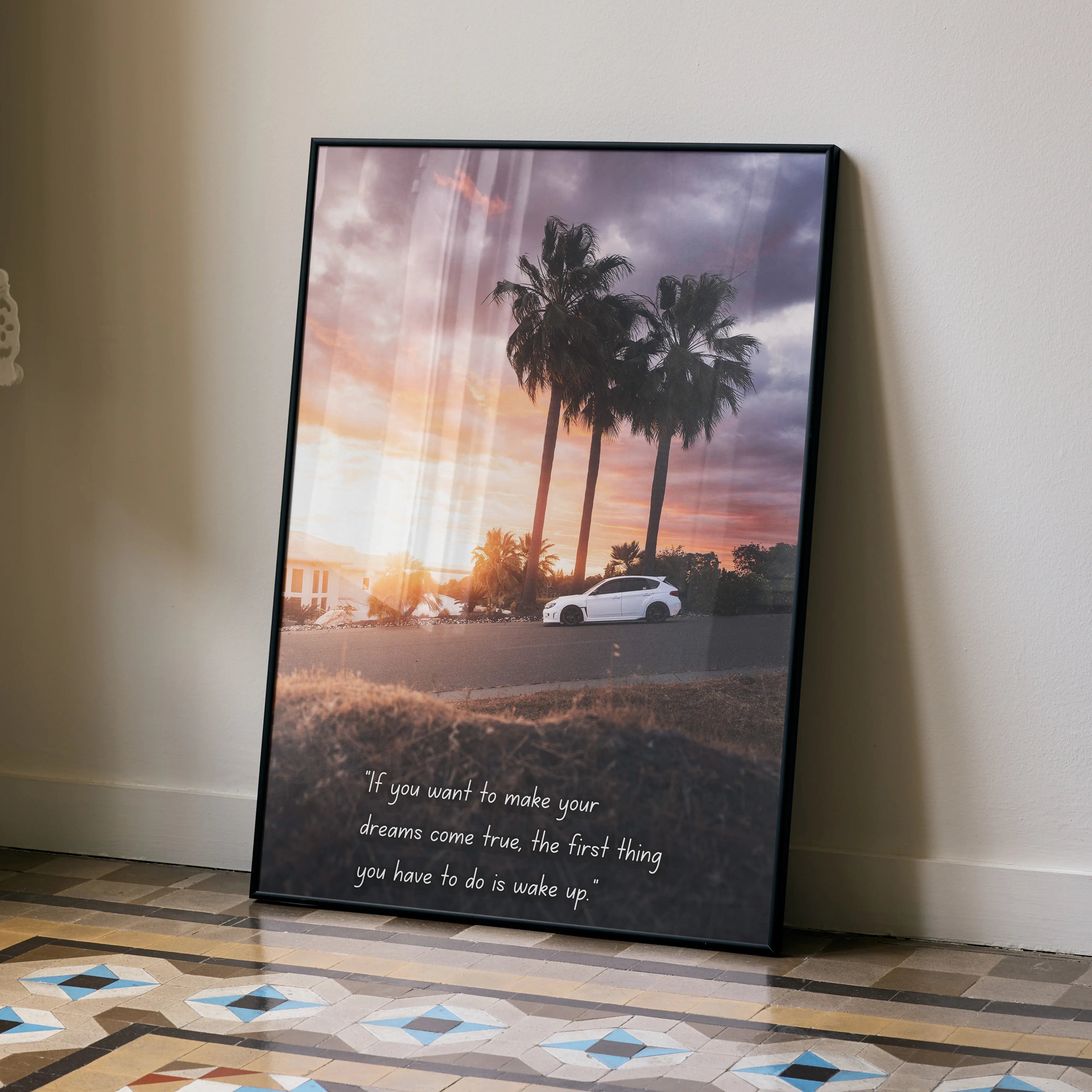 Subaru WRX STI poster wall art with palm trees and sunset background, inspirational text at bottom.