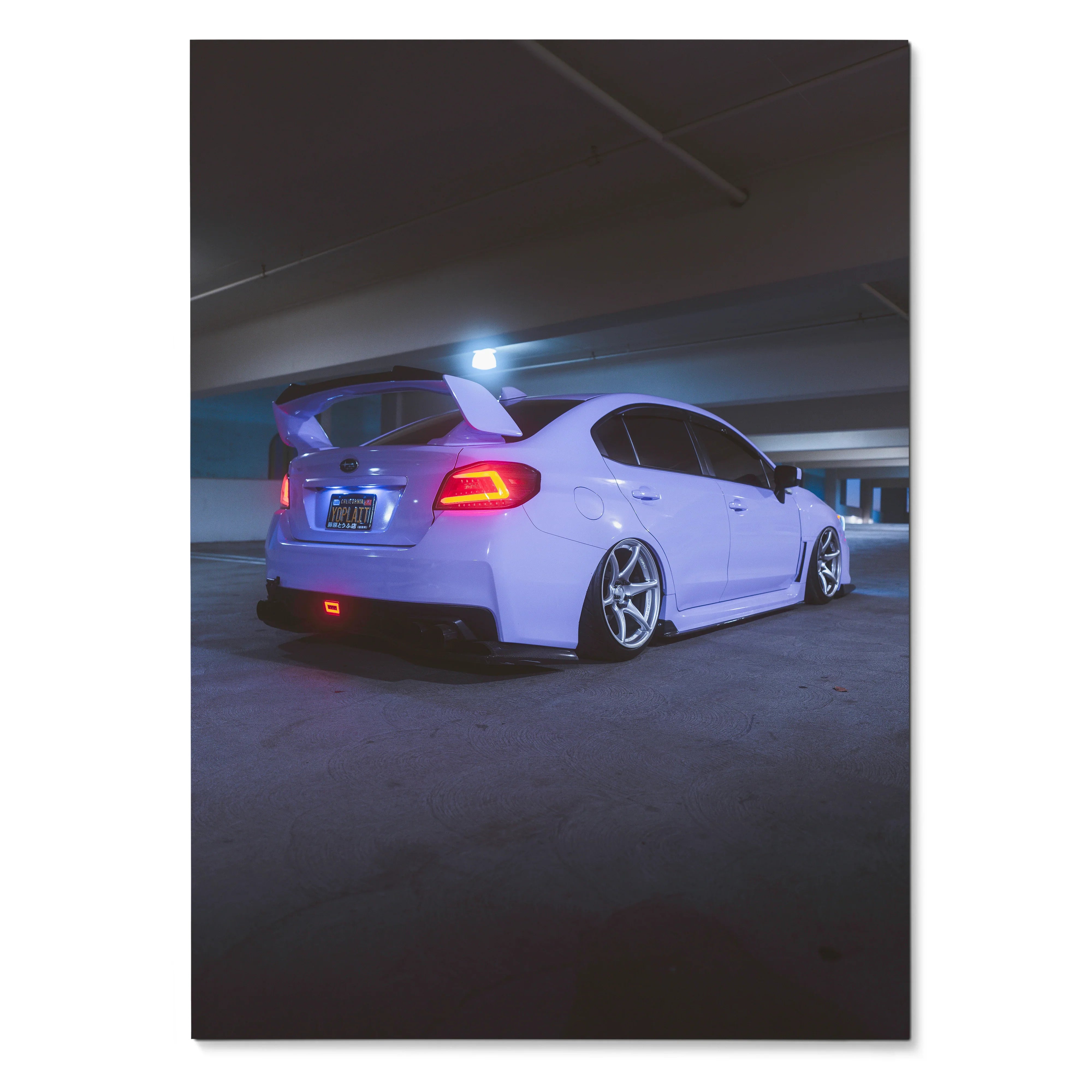 Subaru WRX in white lowered stance with illuminated brake lights poster wall art.
