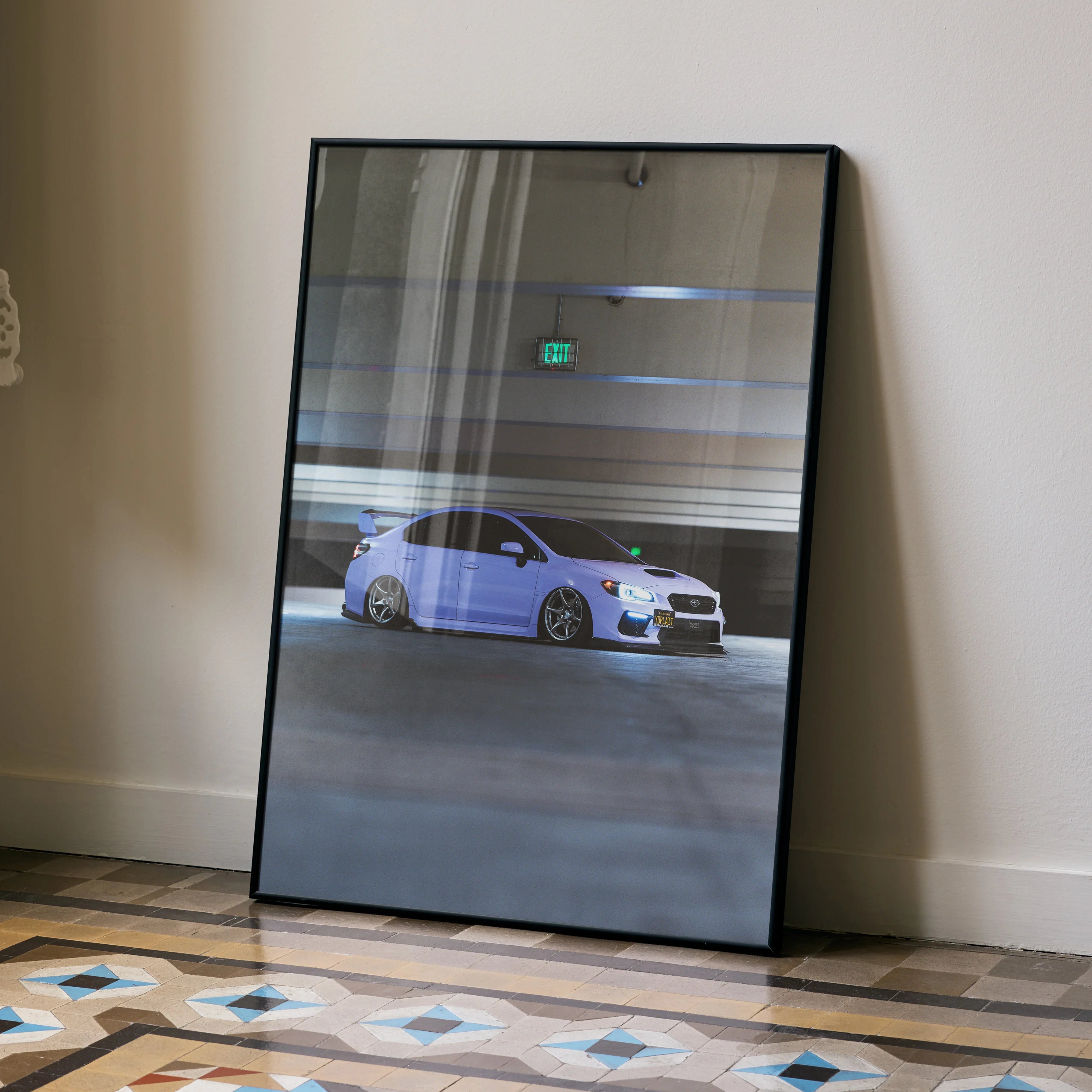 Subaru WRX poster with sleek white sports car racing on dark track, premium wall art in black frame.