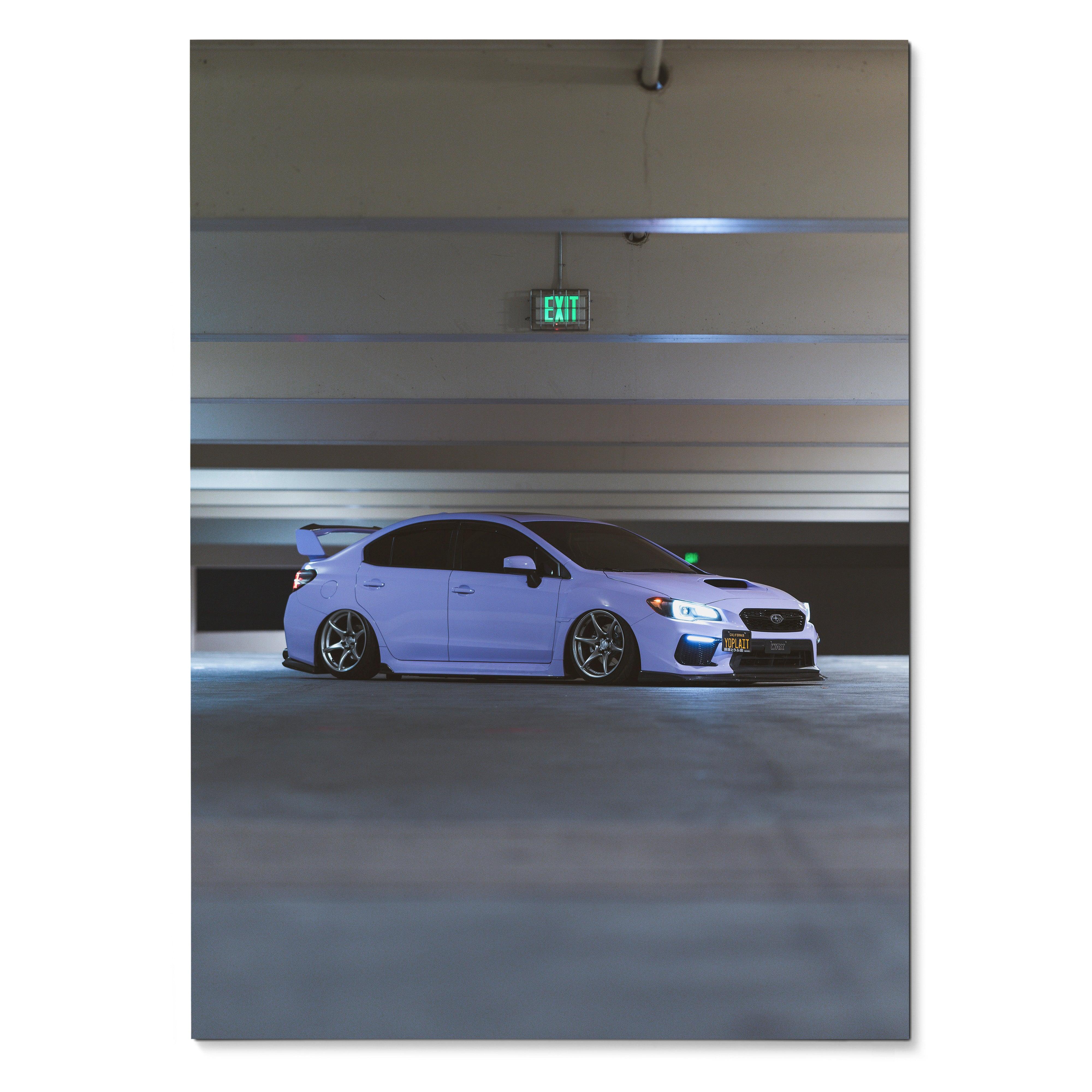 White Subaru WRX parked in dimly lit modern garage poster wall art.