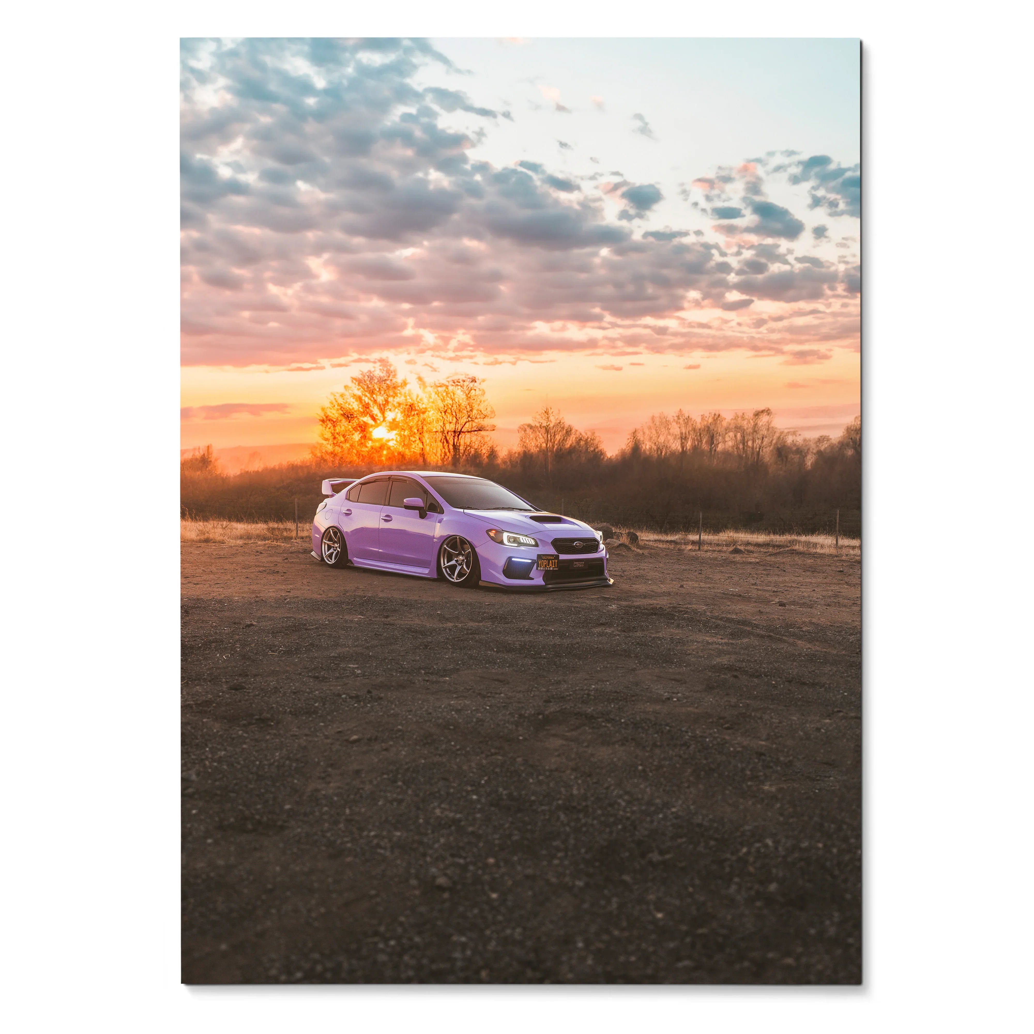 Subaru WRX parked on dirt with vibrant sunset sky poster wall art.