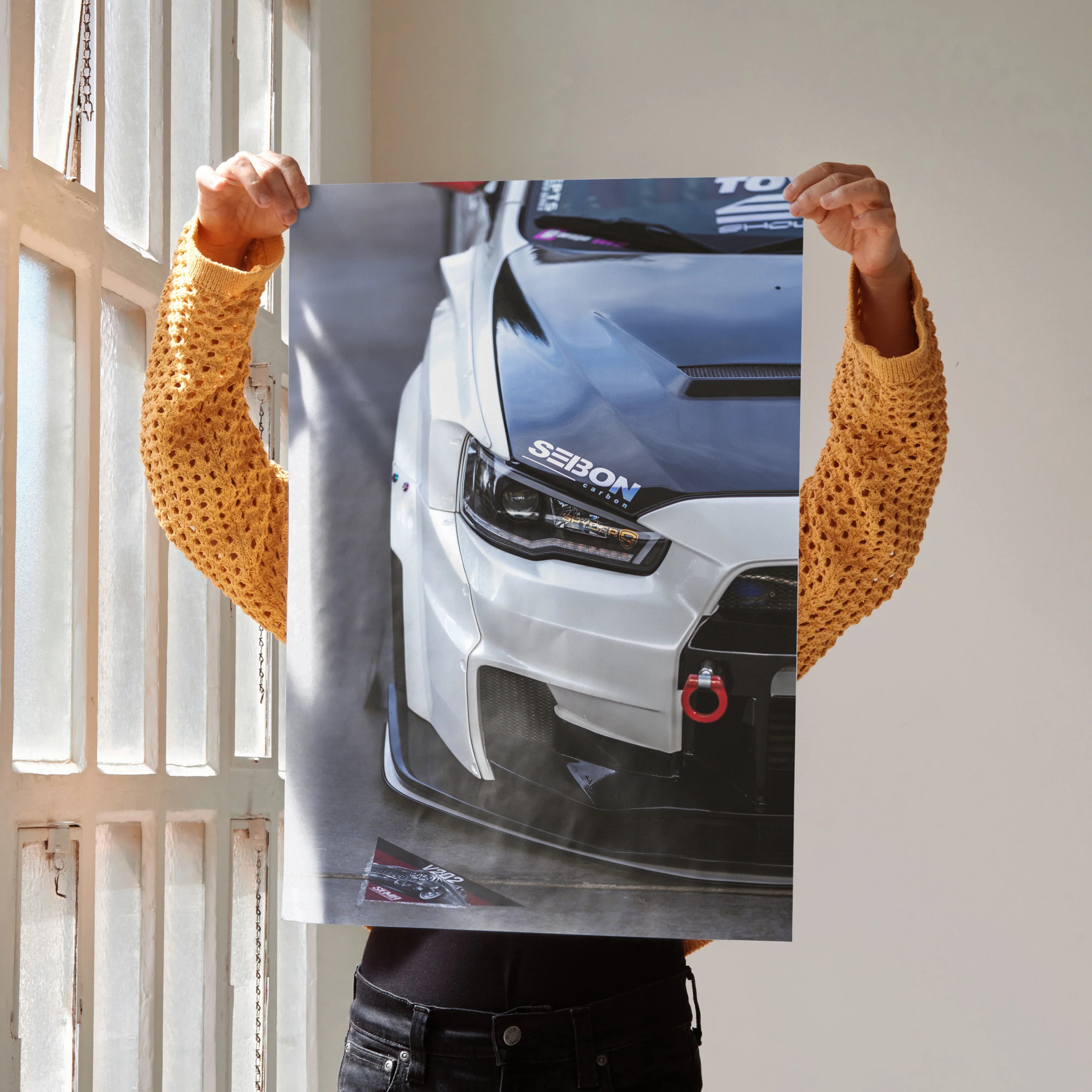 Mitsubishi Evo 10 close-up poster featuring front bumper and headlight design, wall art for automotive fans.