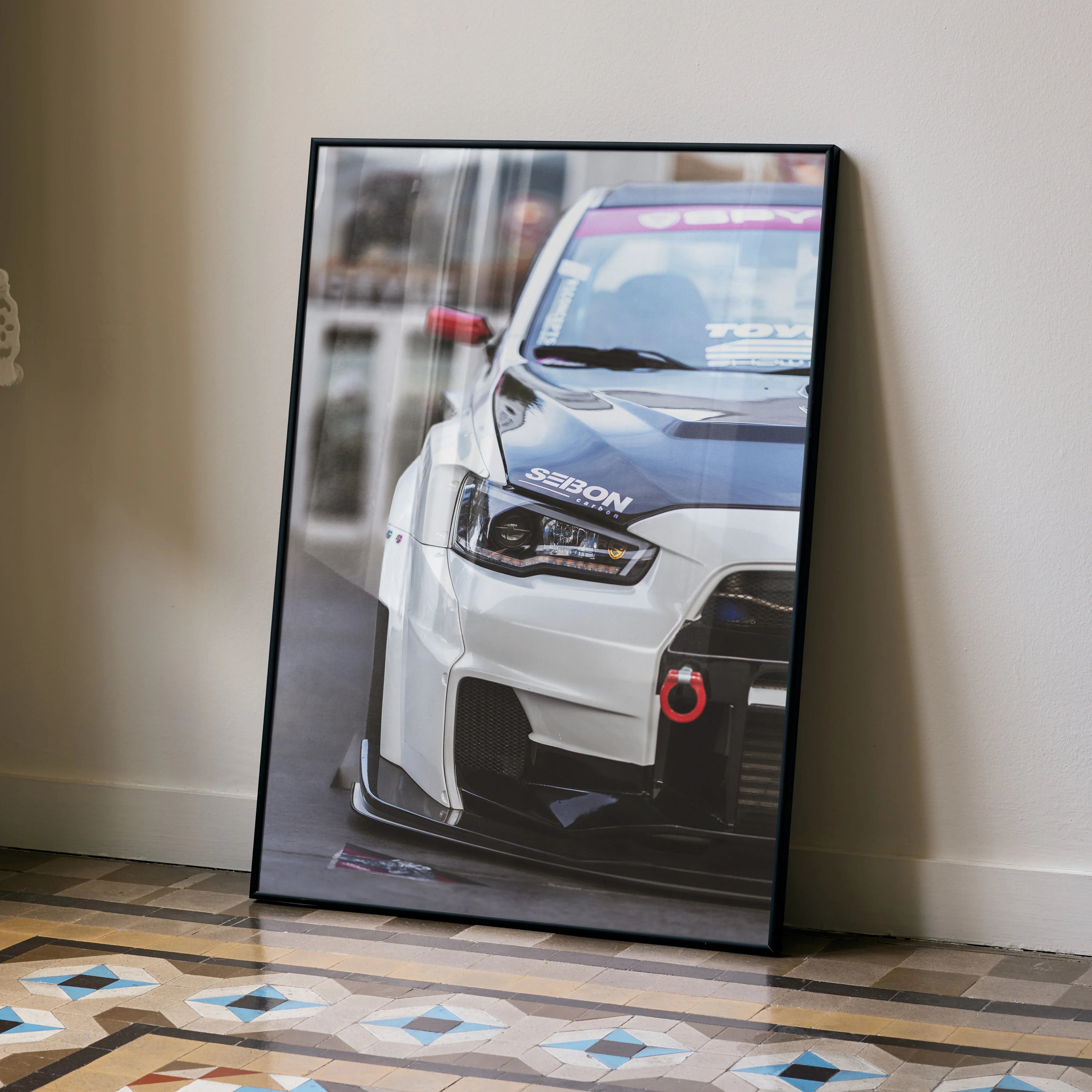 Mitsubishi Evo 10 close-up poster featuring front grille and headlight in high-detail wall art.