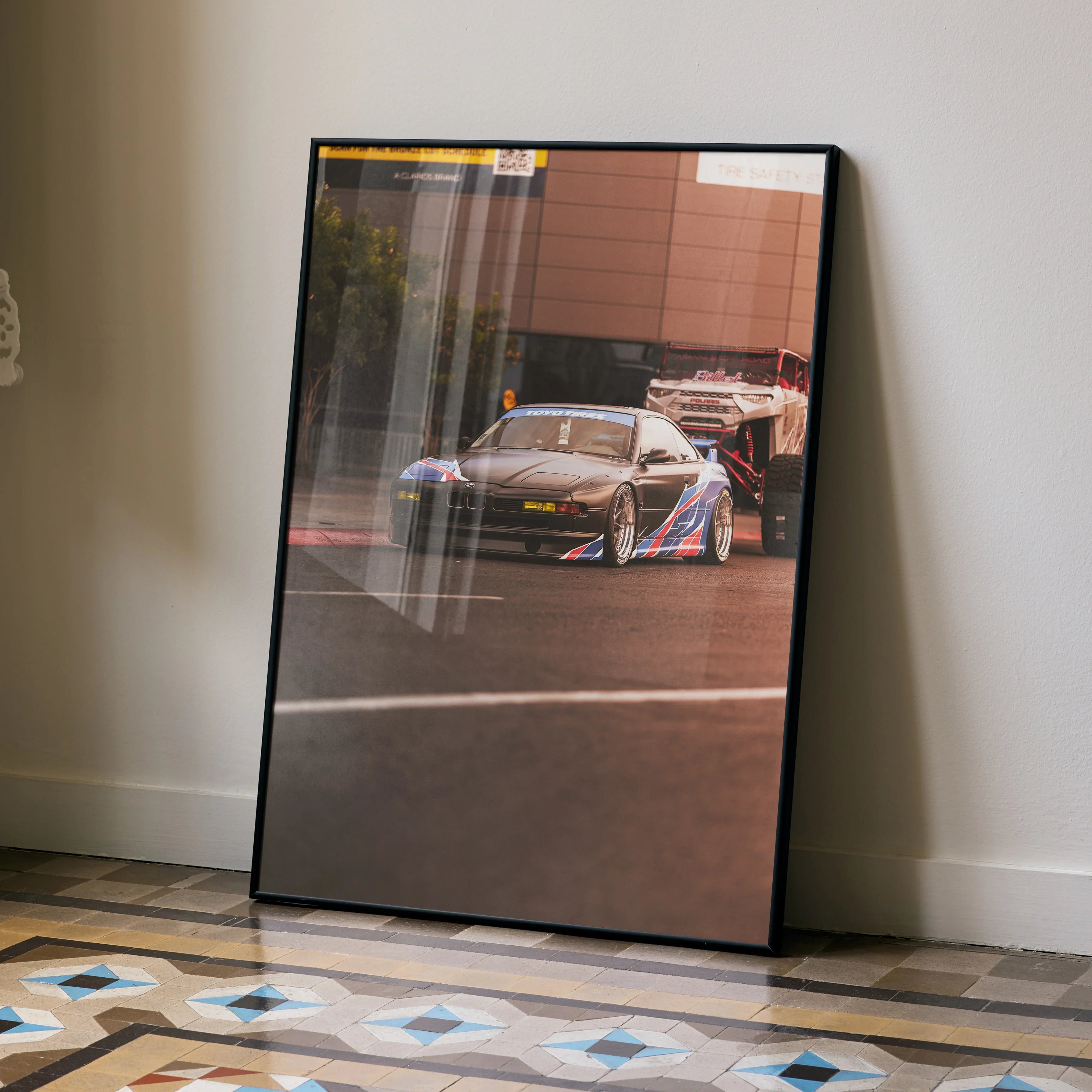 BMW E31 850ci racing car poster with vibrant colors in sleek black frame wall art.