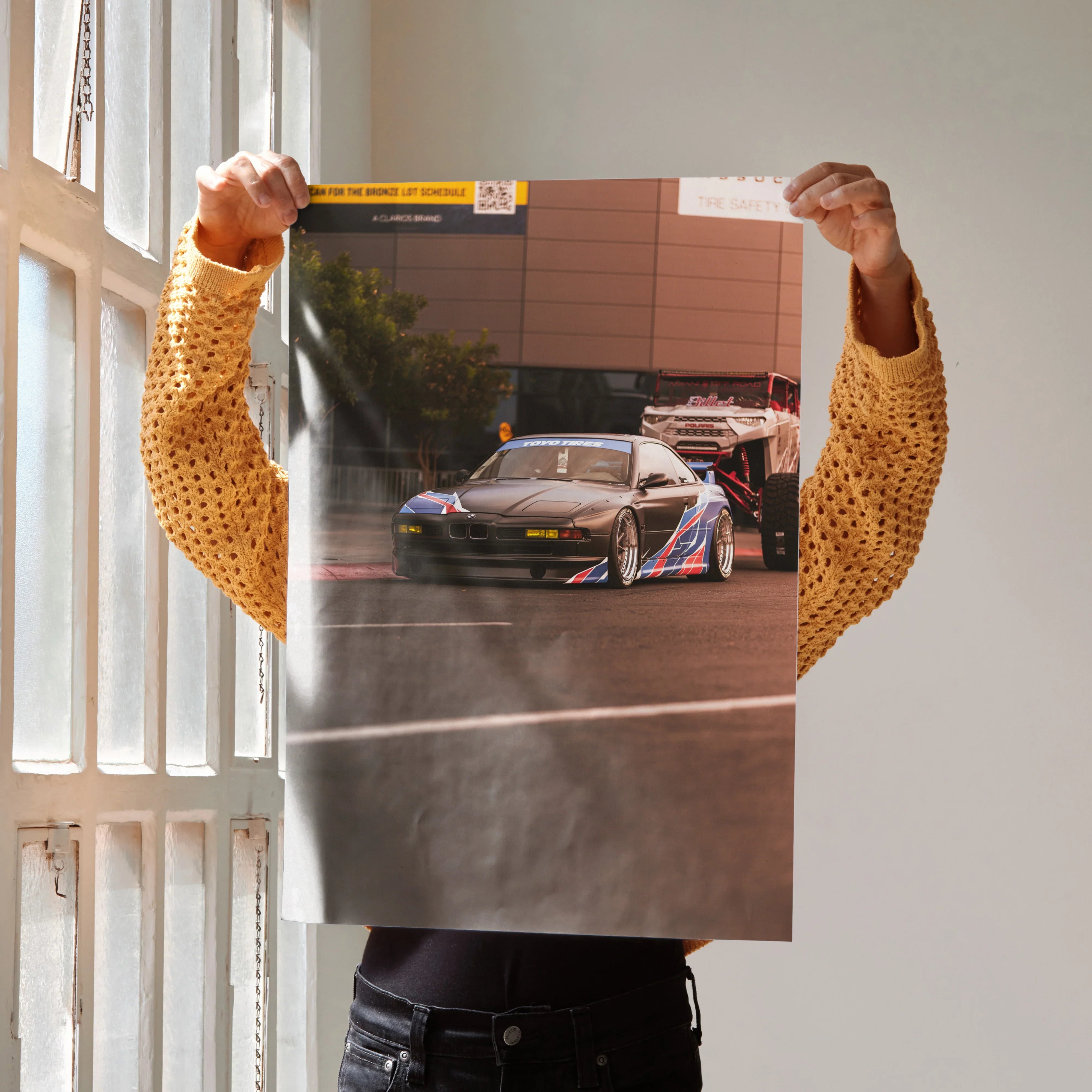 BMW E31 850ci high-resolution poster showing sleek black sports car in urban setting, wall art print.