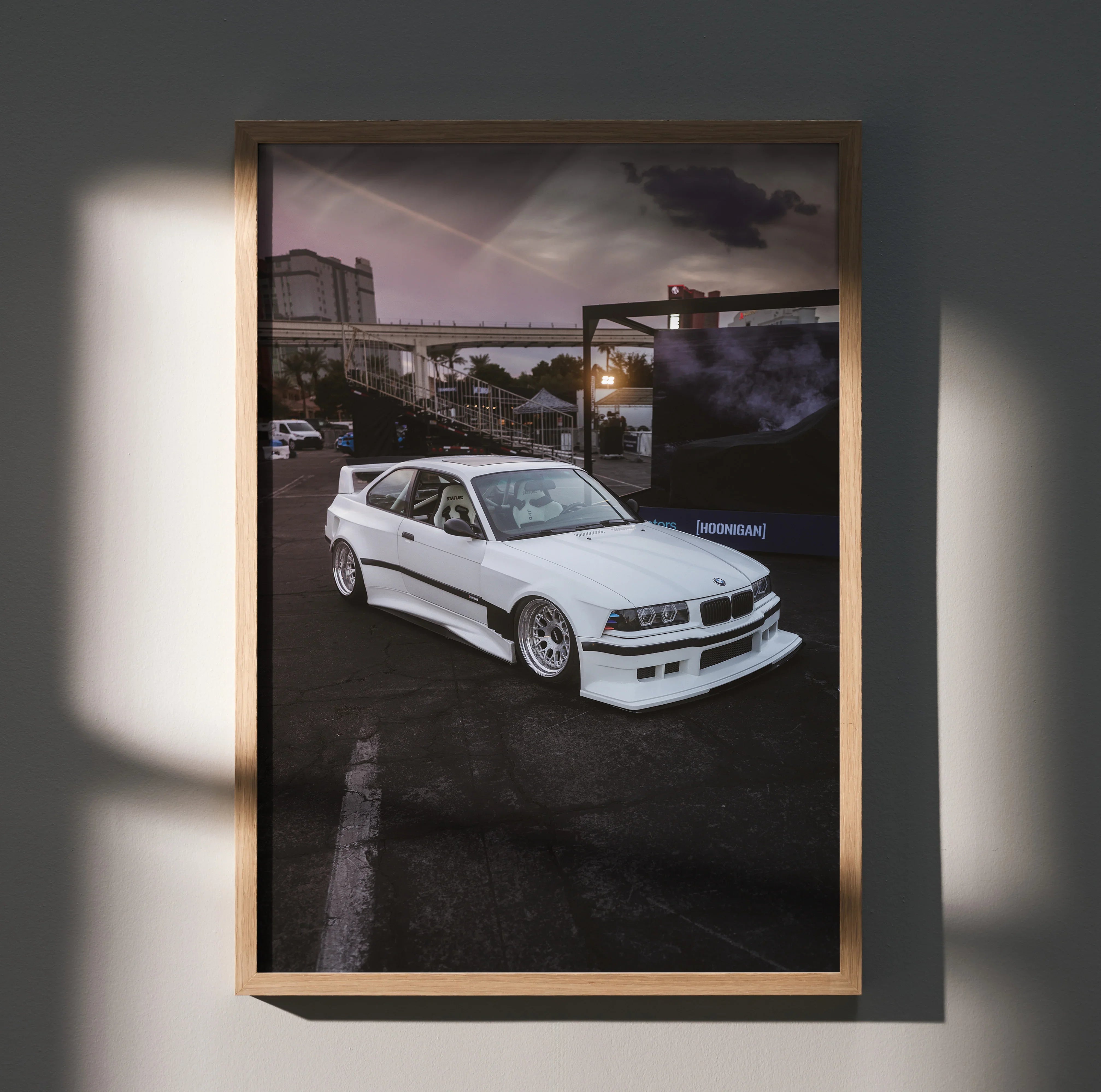 BMW E36 M3 white sports car wall art poster in urban night setting with dark sky.