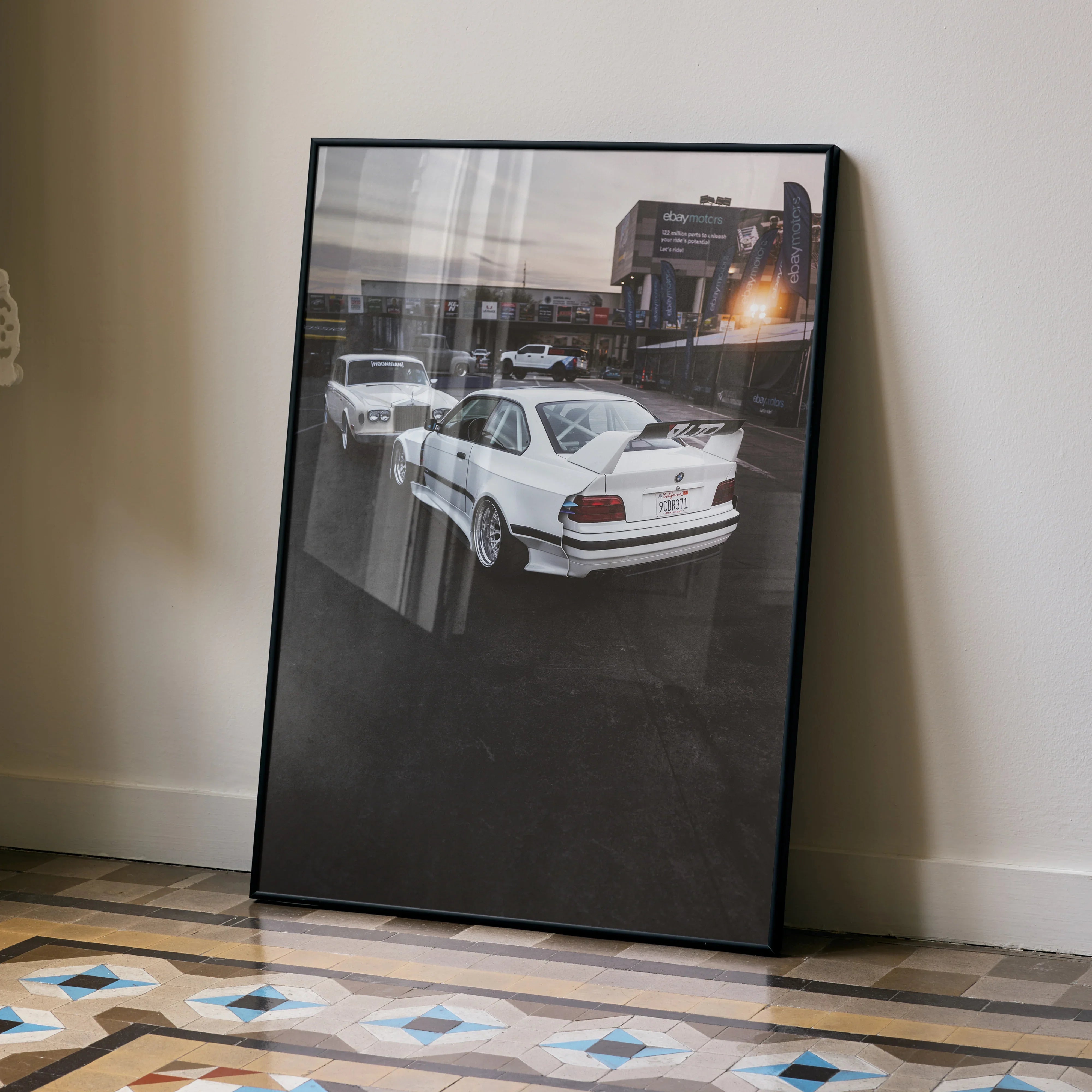 BMW E36 M3 poster leaning against wall, framed premium automotive wall art.