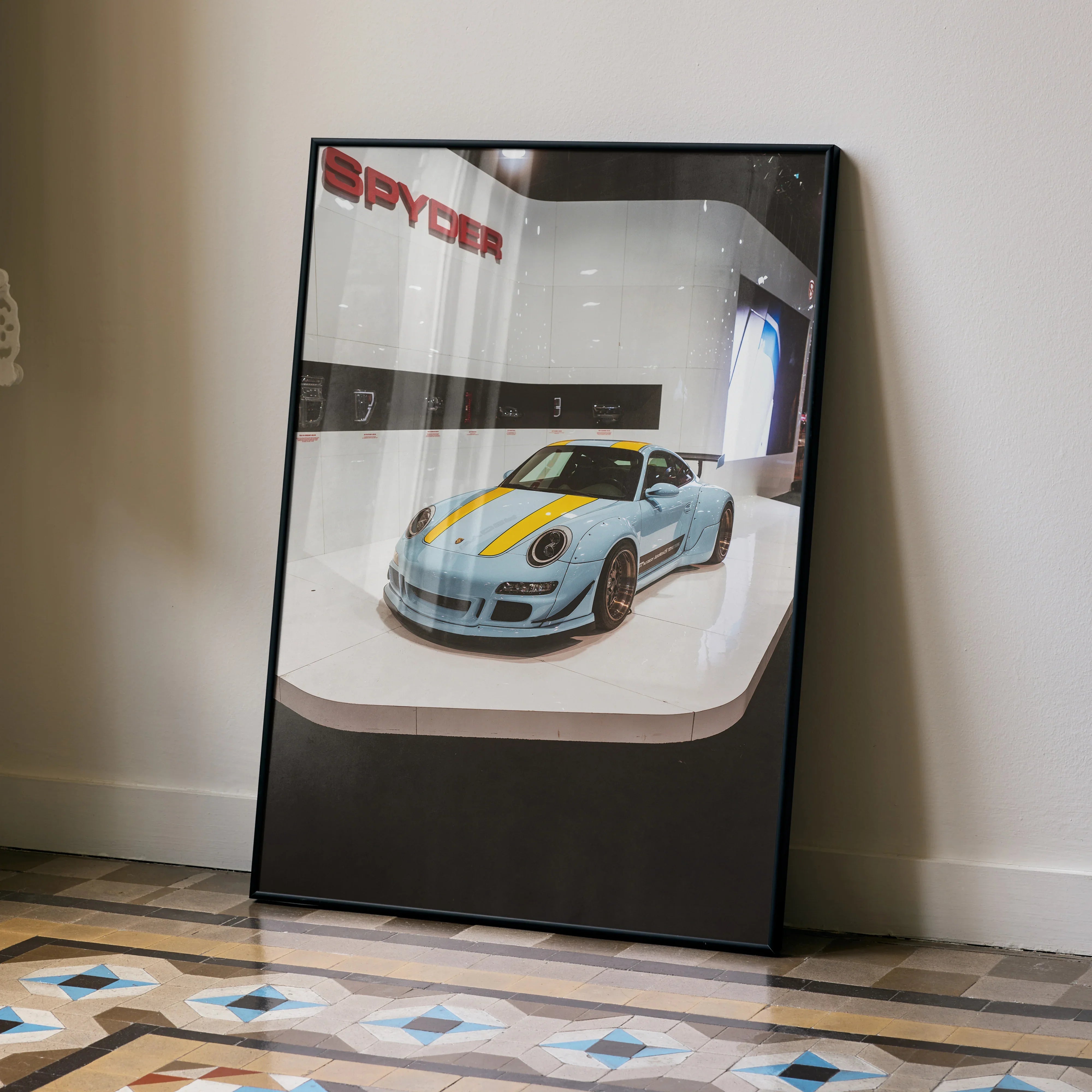 Porsche 911 Carrera 4 poster with silver car and yellow racing stripes, modern wall art display.