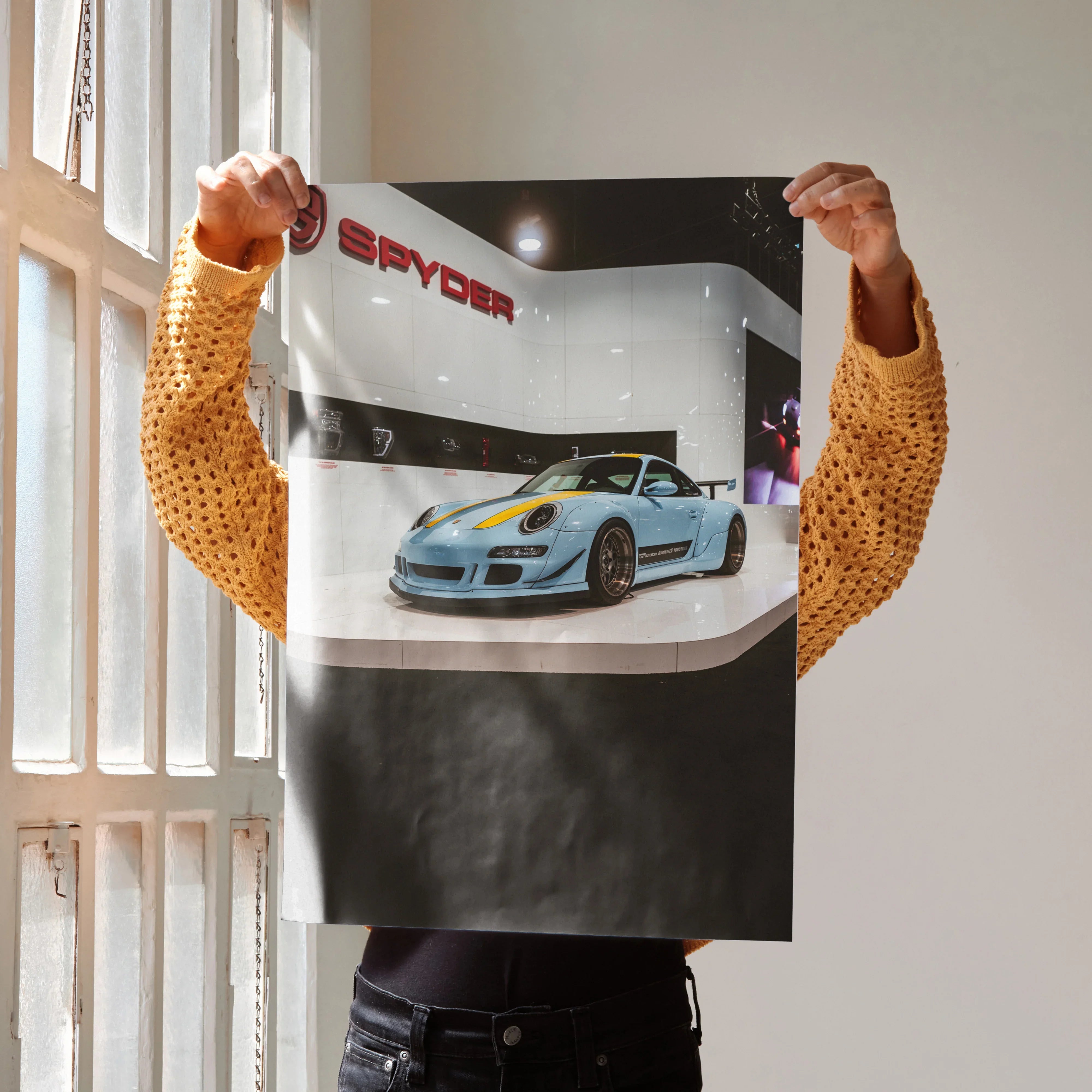 Porsche 911 Carrera 4 in light blue displayed on glossy automotive wall art poster.