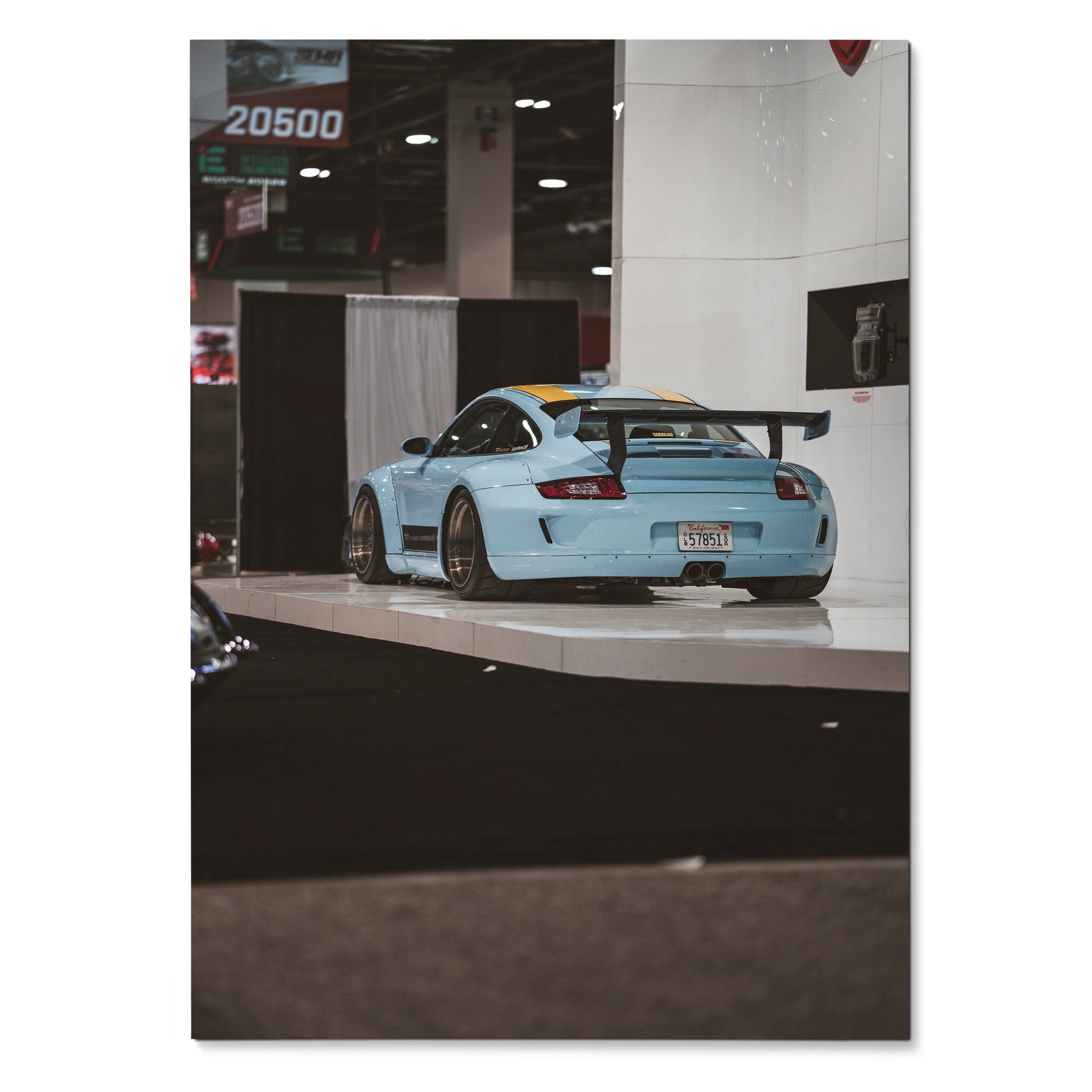 Porsche 911 Carrera 4 in light blue with rear spoiler on glossy poster wall art.