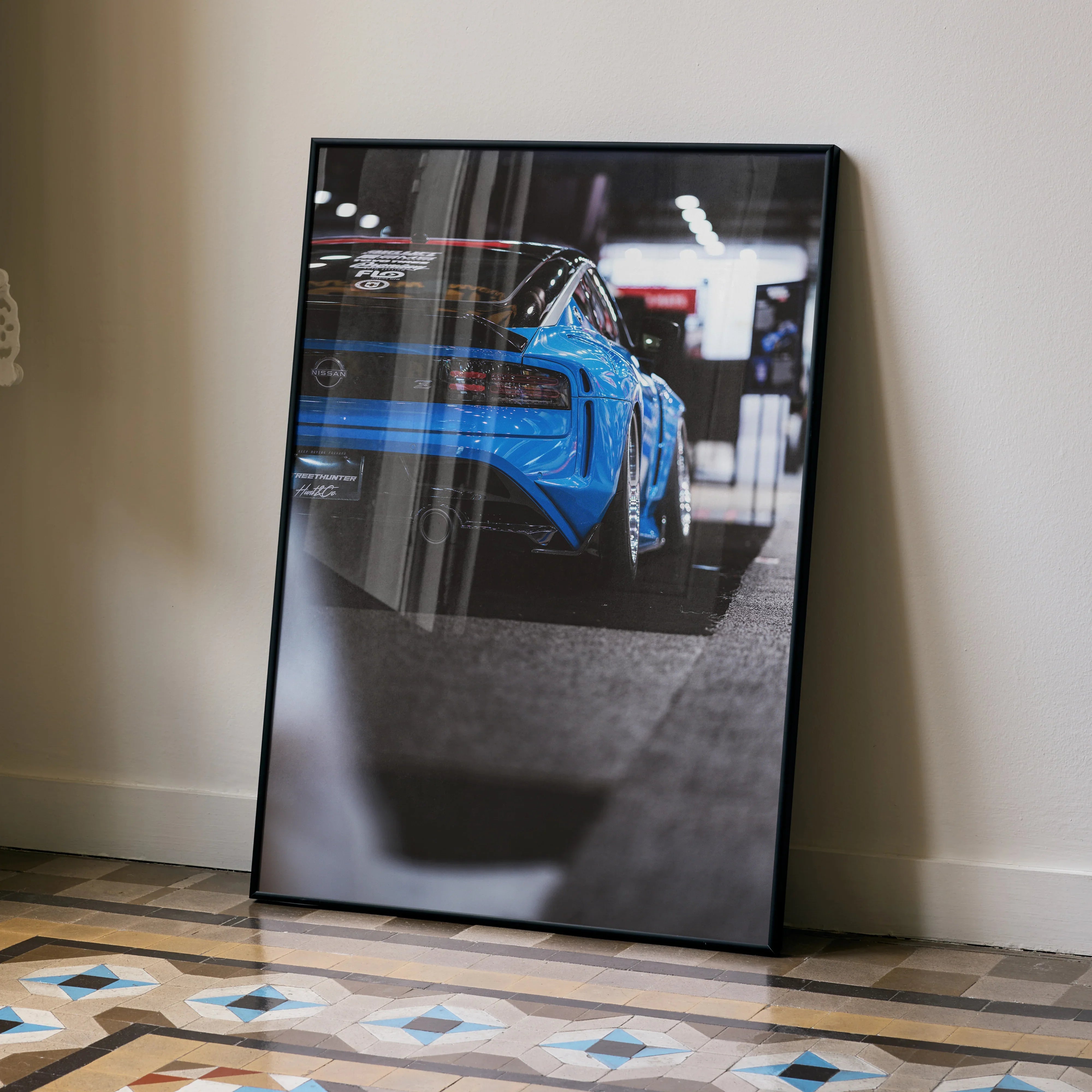 Nissan Z (RZ34) poster featuring rear side view of blue sports car in modern wall art style.