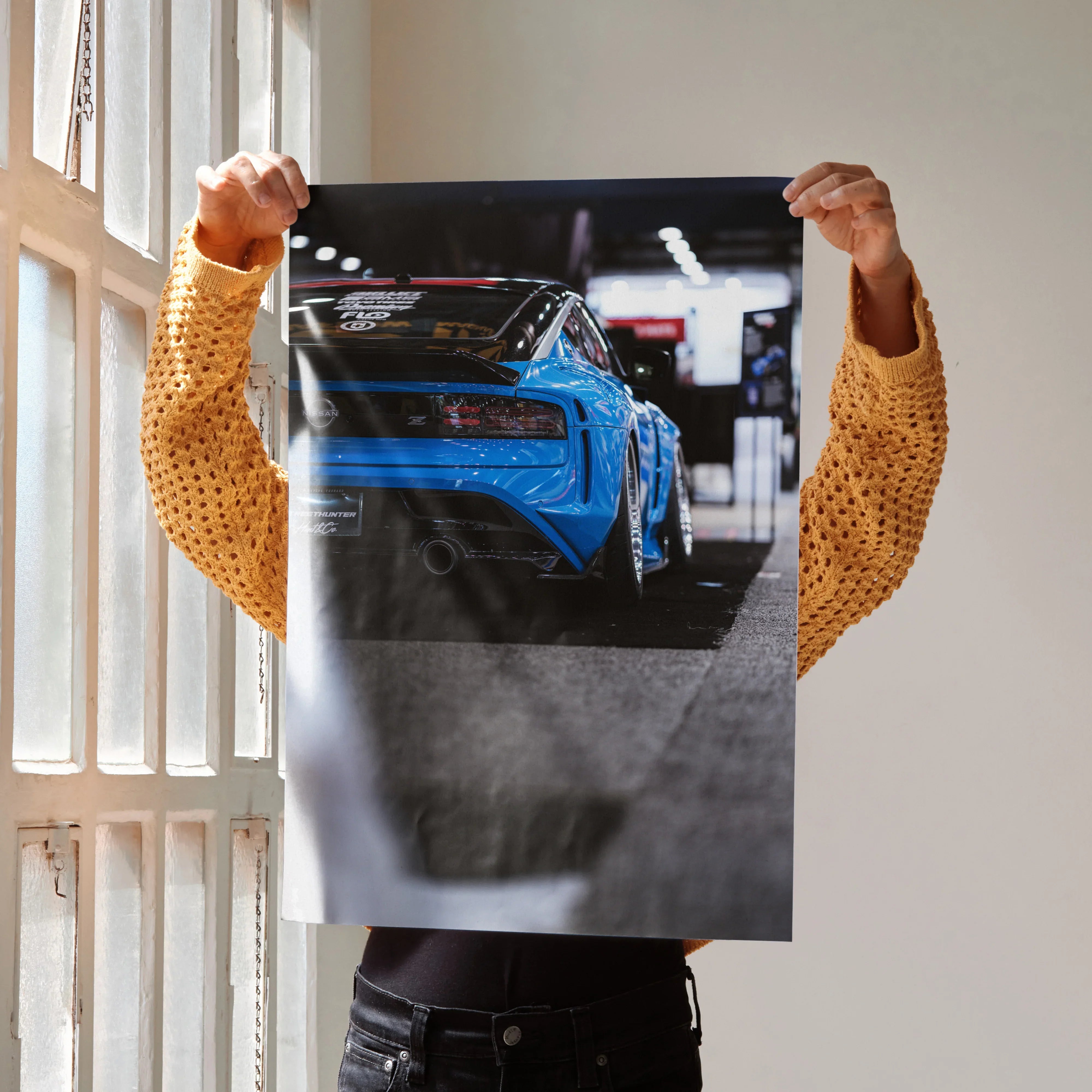 Nissan Z (RZ34) in vibrant blue depicted on high-resolution automotive poster wall art.