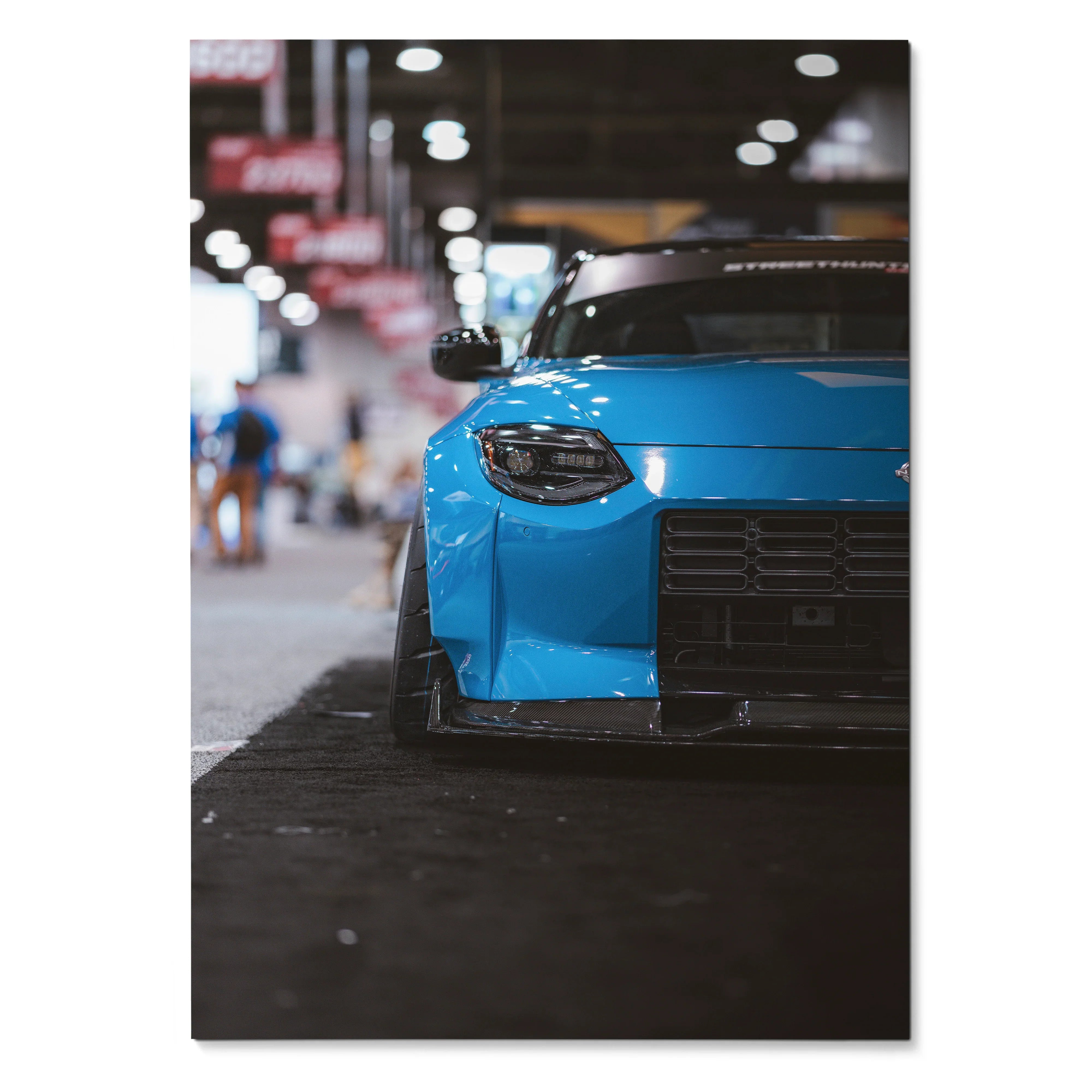 Blue Nissan Z RZ34 front view poster wall art with urban blurred background.