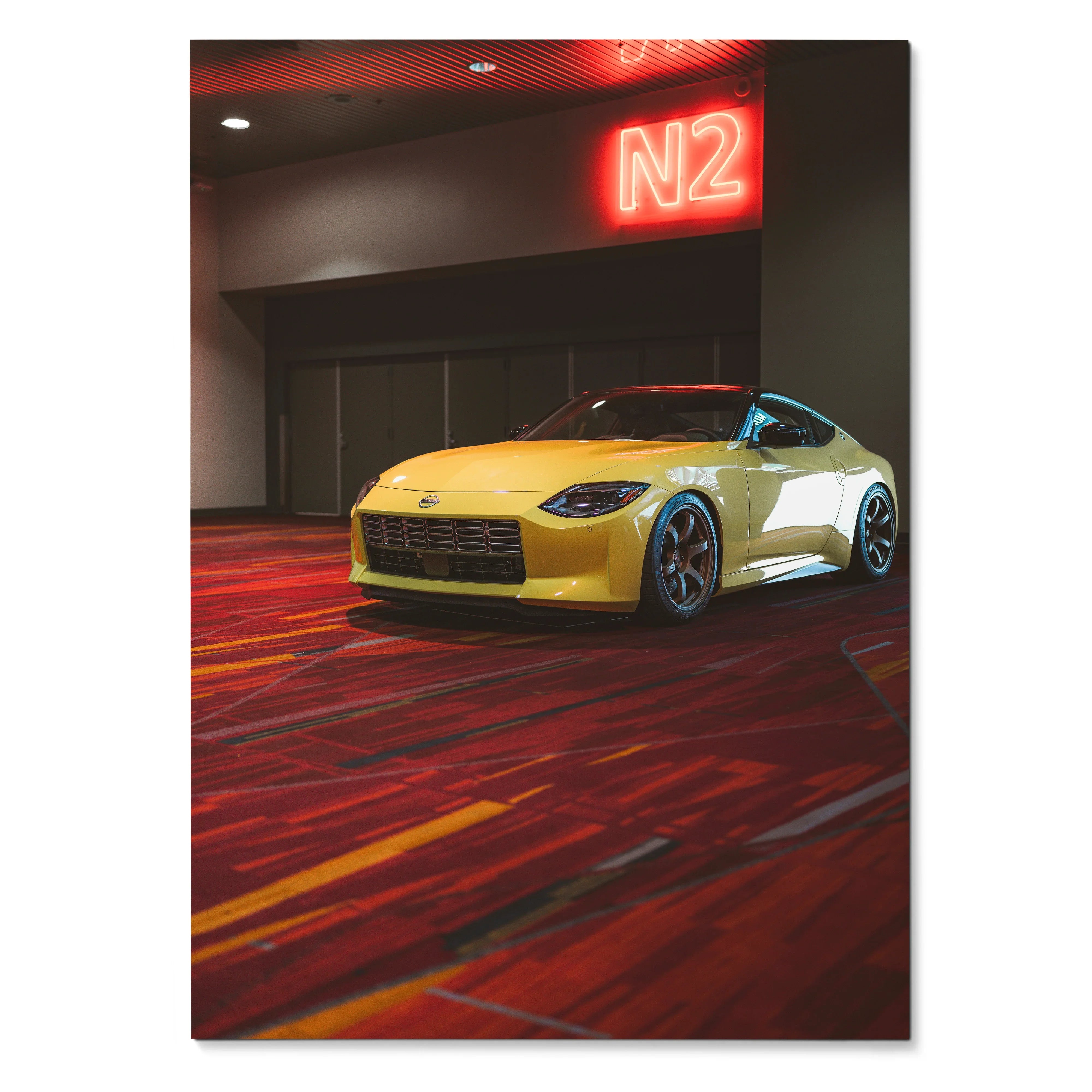 High-resolution poster of a yellow Nissan Z (RZ34) parked indoors with red neon N2 sign wall art.