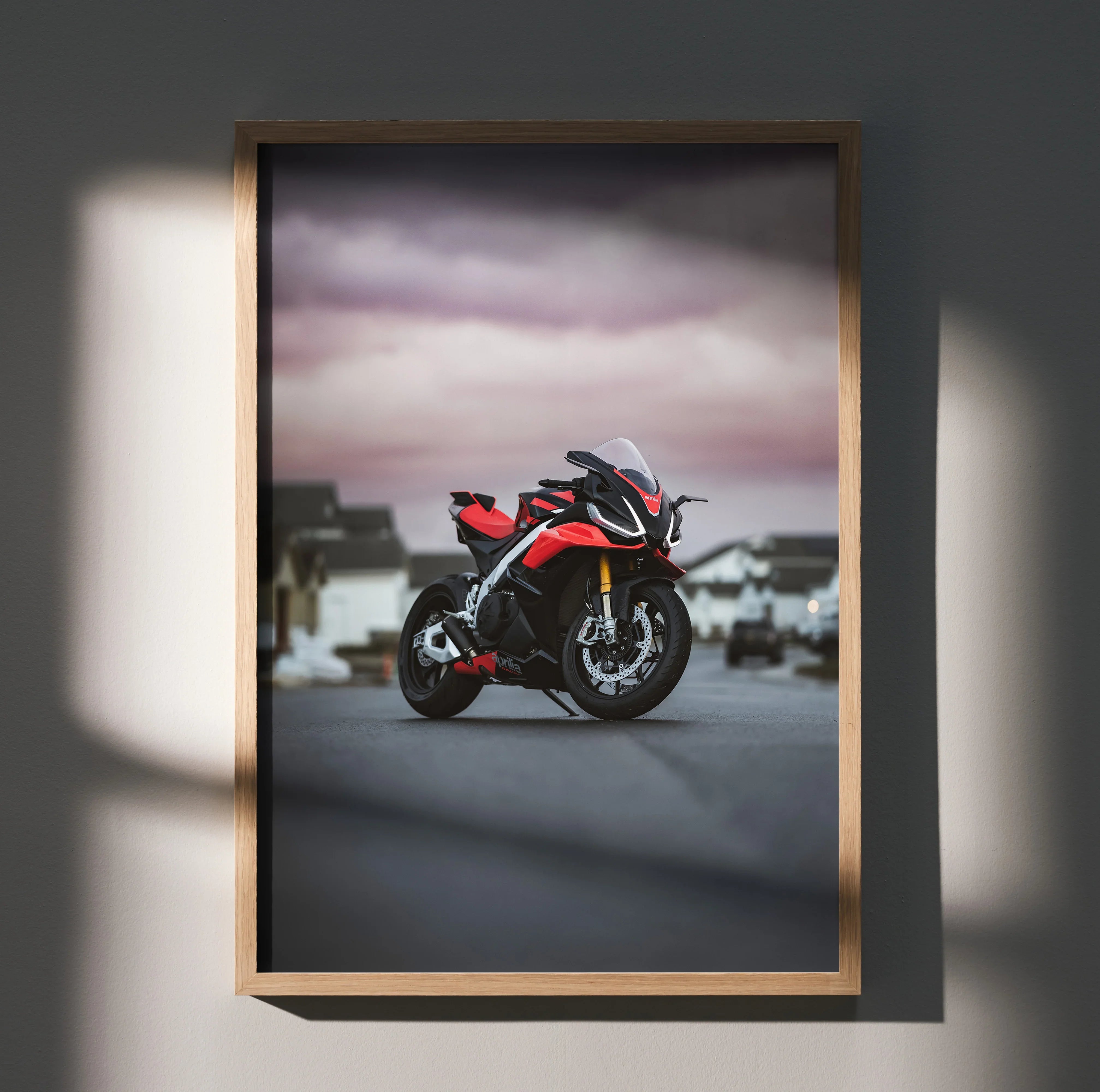Aprilia RSV4 1100 Factory motorcycle poster with red and black sportbike under moody sky wall art.