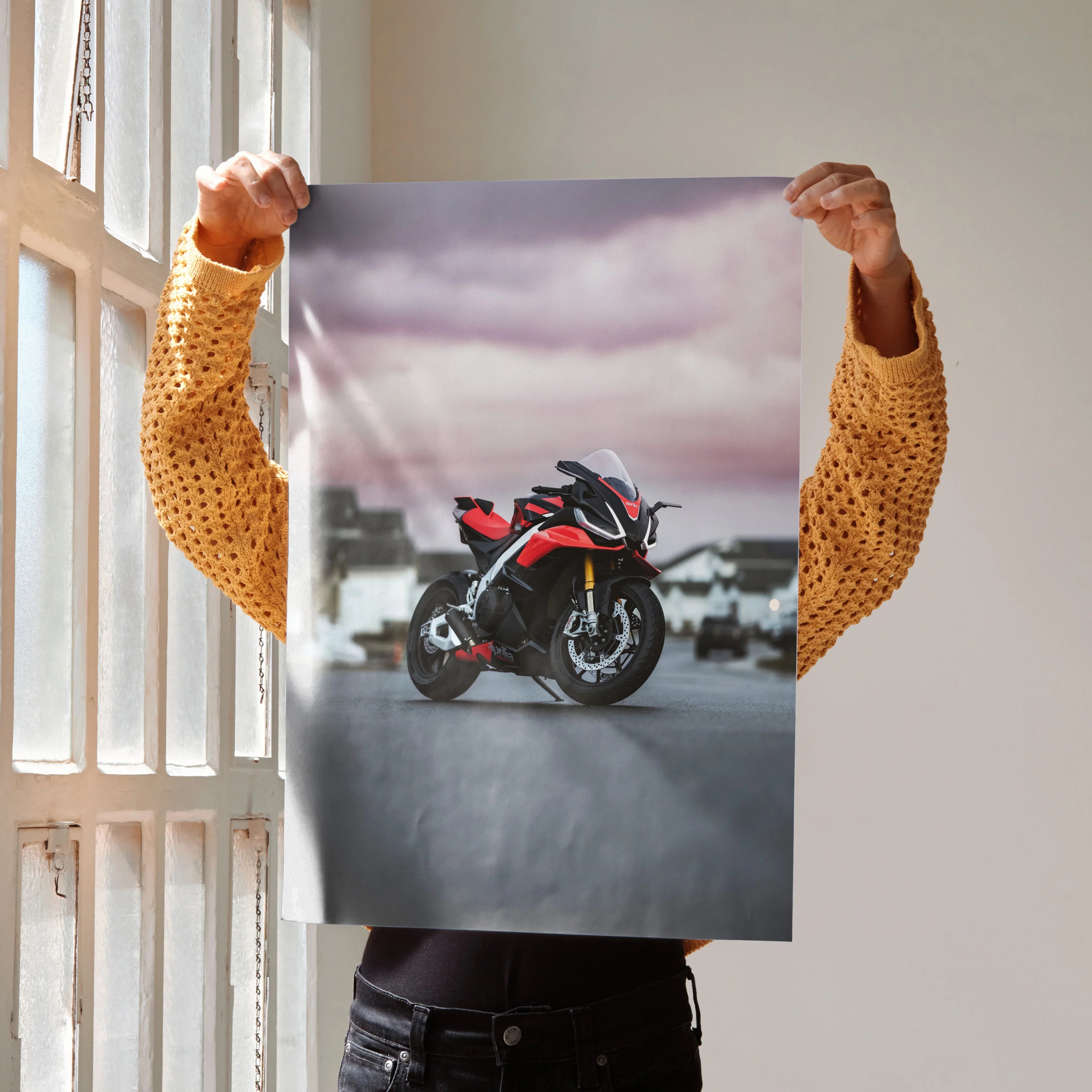 Poster of Aprilia RSV4 1100 Factory motorcycle with dramatic sky, sleek red and black design wall art.