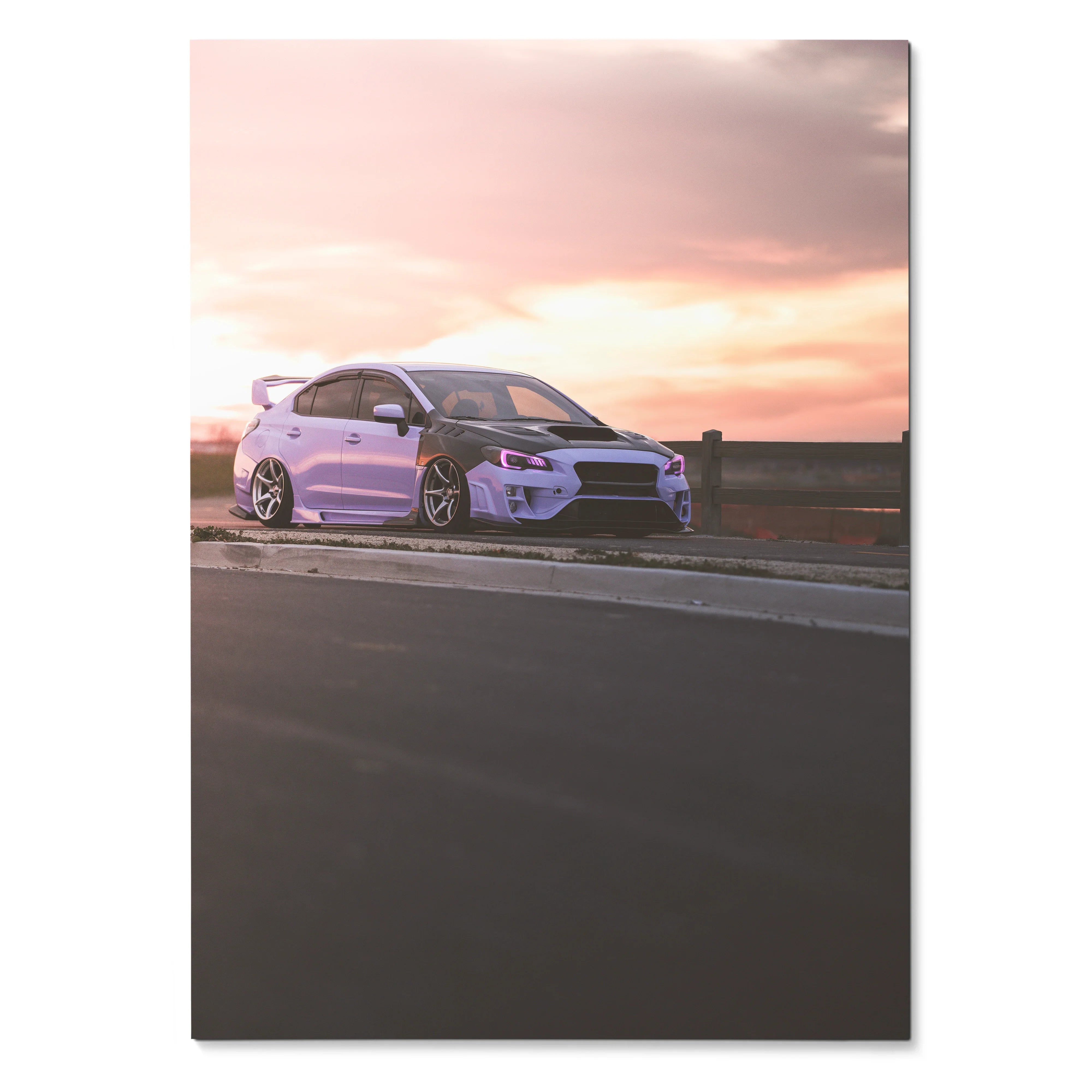 Subaru WRX parked roadside at sunset poster wall art with pink and purple sky.