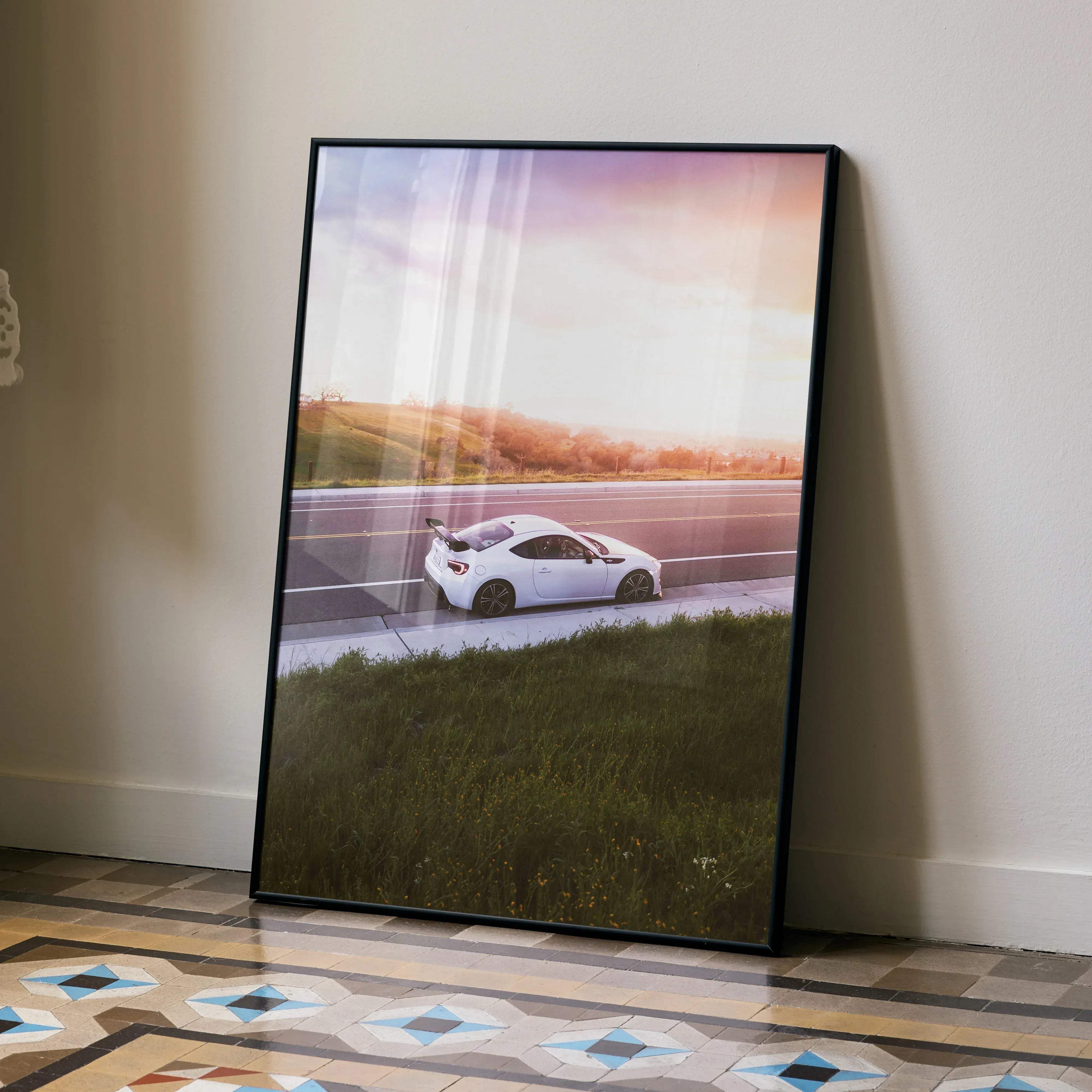 Black-framed art print of a white Toyota FRS sports car on a road at sunset high resolution car poster 002