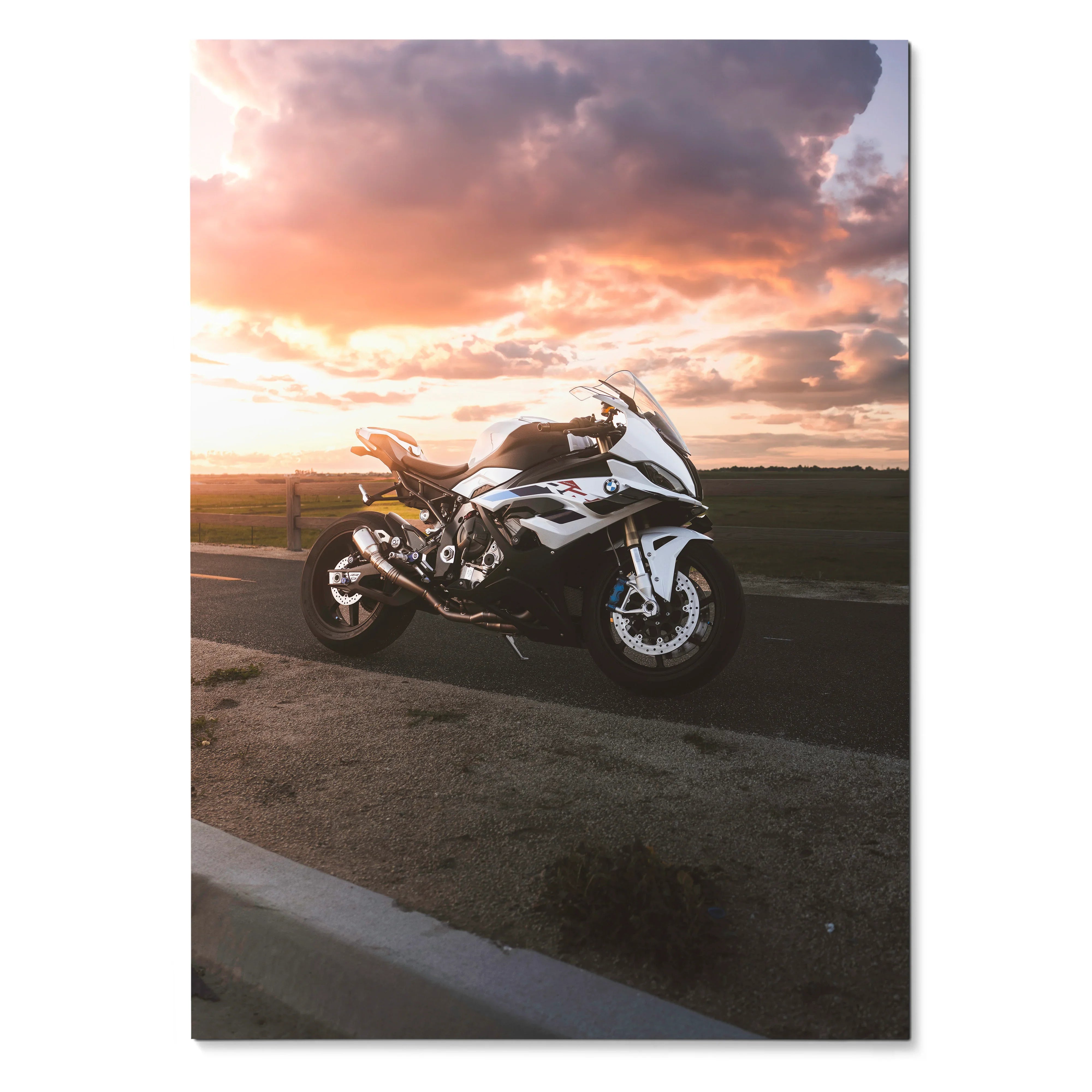 BMW S1000RR motorcycle wall art poster with sunset sky and dramatic clouds background.