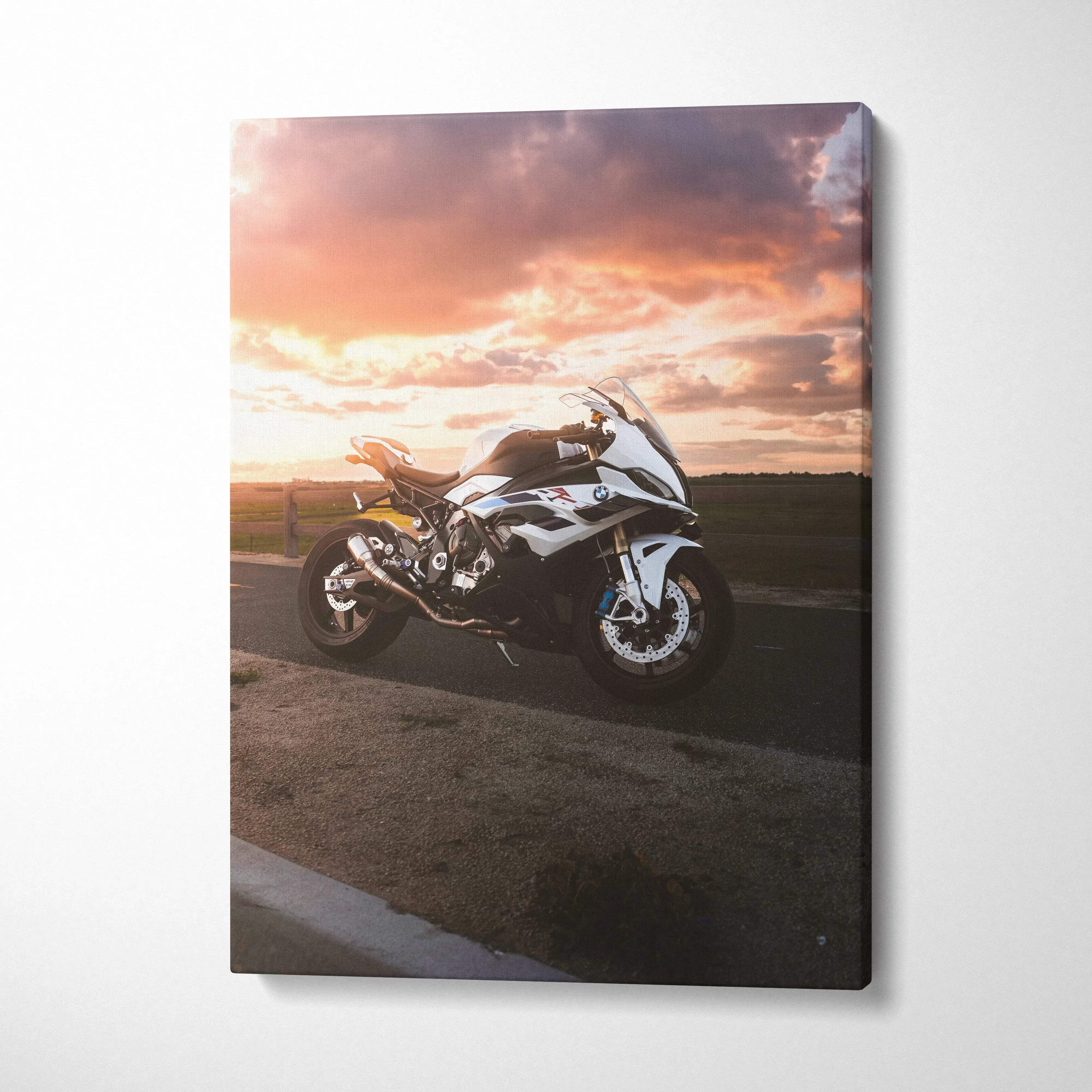 Vertical canvas wall art featuring a BMW S1000RR motorcycle against a vibrant sunset sky.