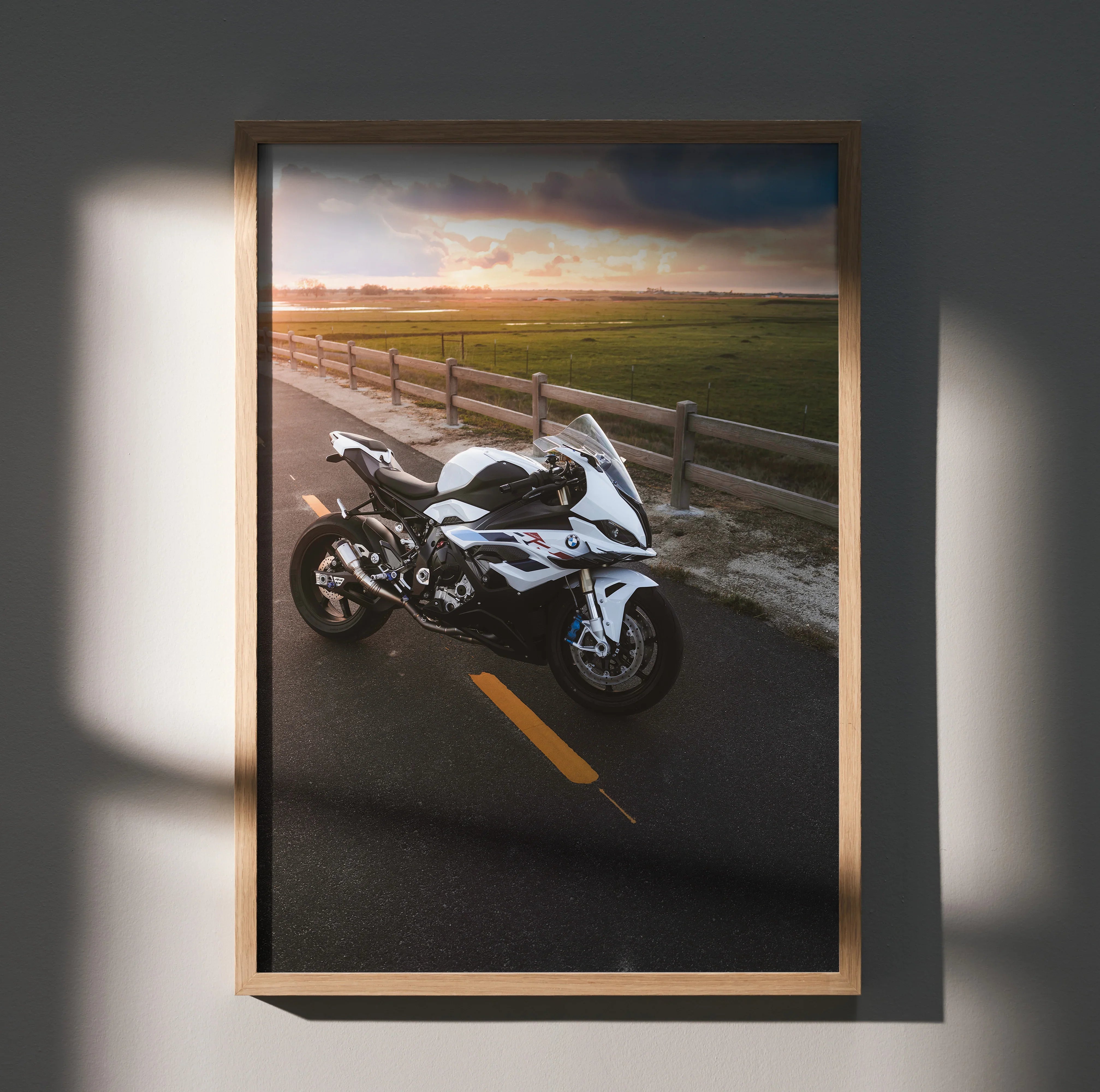 BMW S1000RR motorcycle poster with sunset landscape, premium wall art in wooden frame.