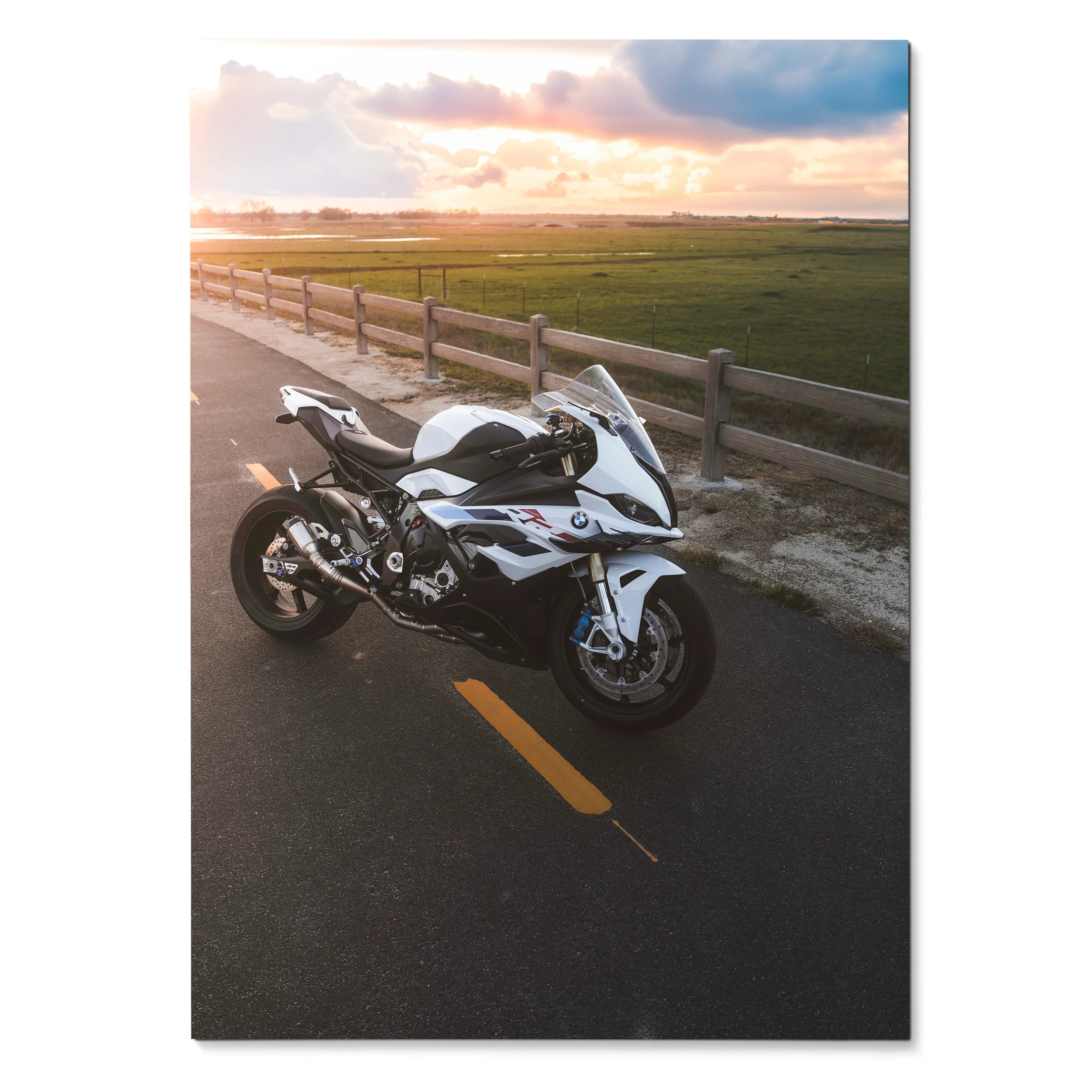 BMW S1000RR motorcycle parked on road at sunset poster wall art with scenic background.