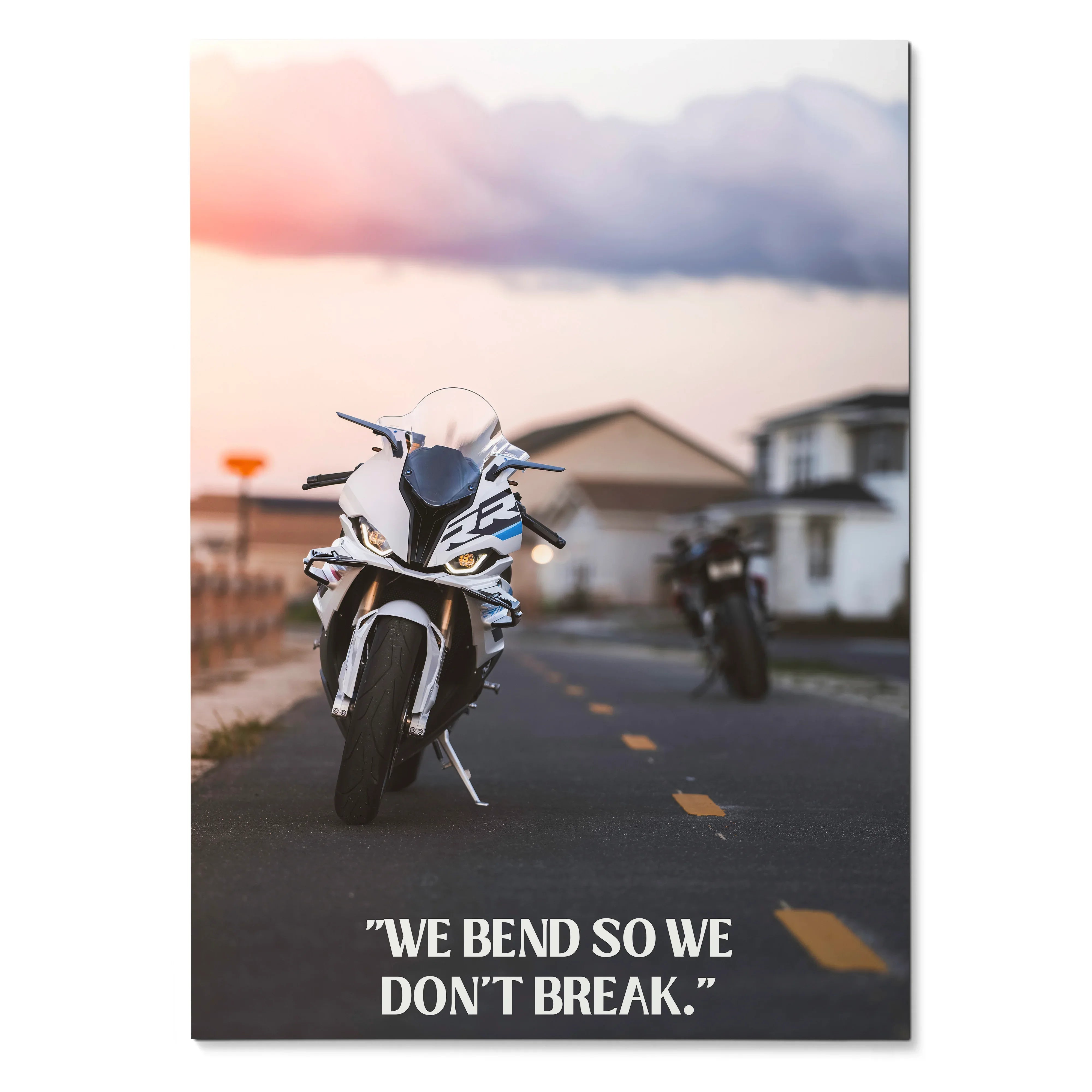 Motivational poster wall art featuring BMW S1000RR motorcycle on road with inspiring text "We bend so we don't break.".