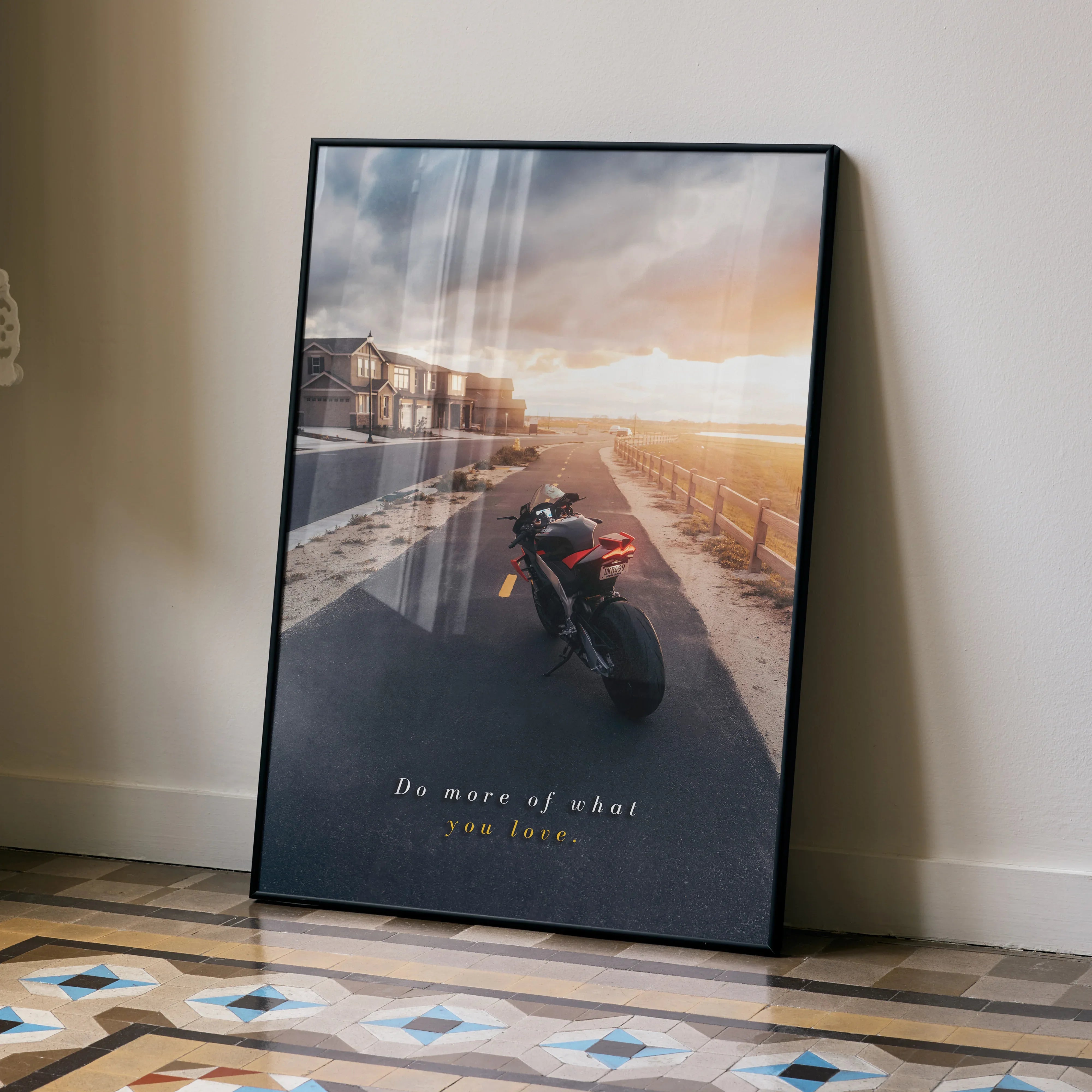 Motivational poster featuring Aprilia RSV4 1100 Factory motorcycle on scenic road at sunset wall art.