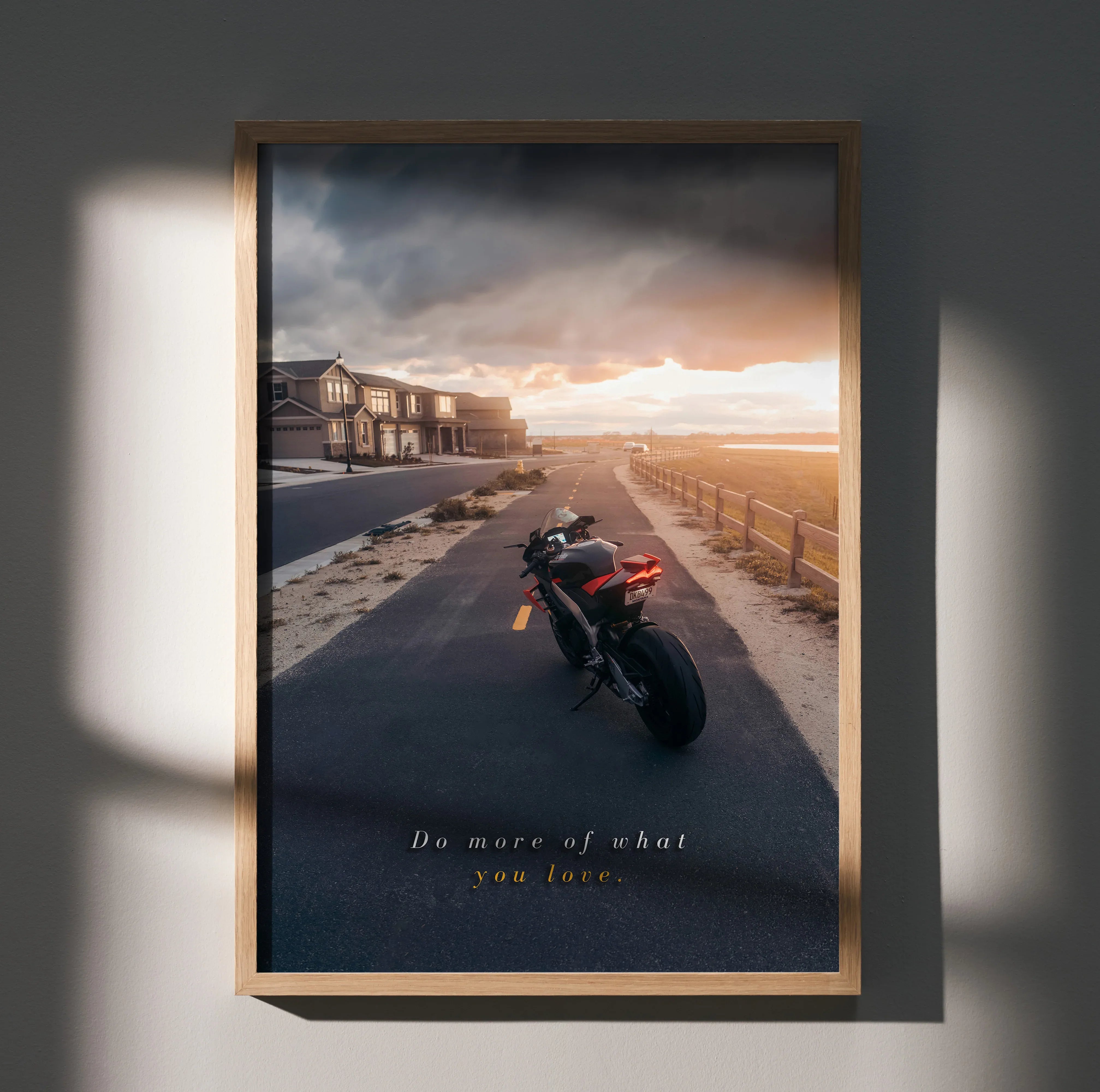 Motivational poster wall art of Aprilia RSV4 1100 Factory motorcycle on coastal road at sunset.