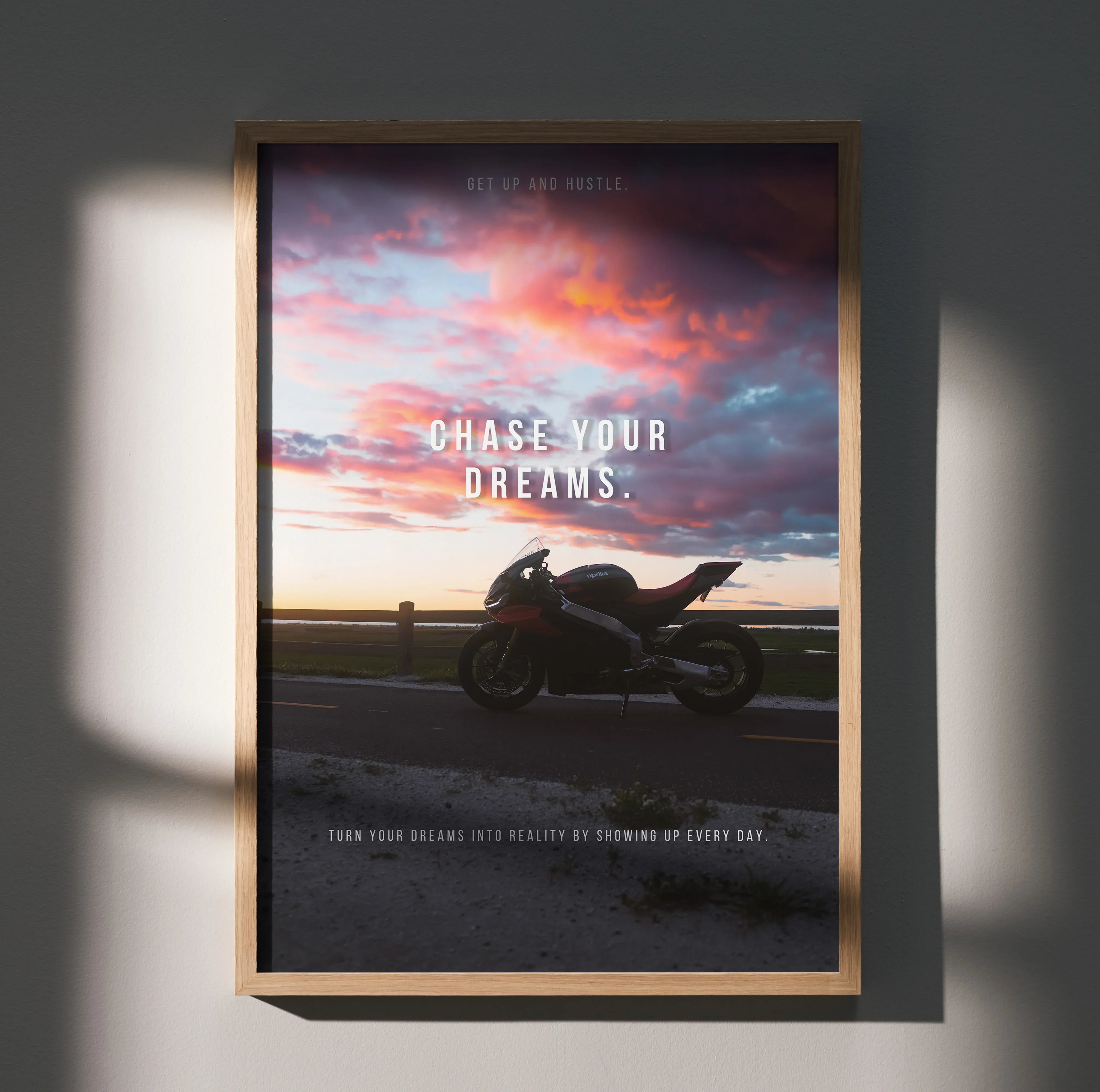 Motivational poster wall art featuring Aprilia RSV4 1100 Factory motorcycle silhouette at sunset with "Chase Your Dreams".