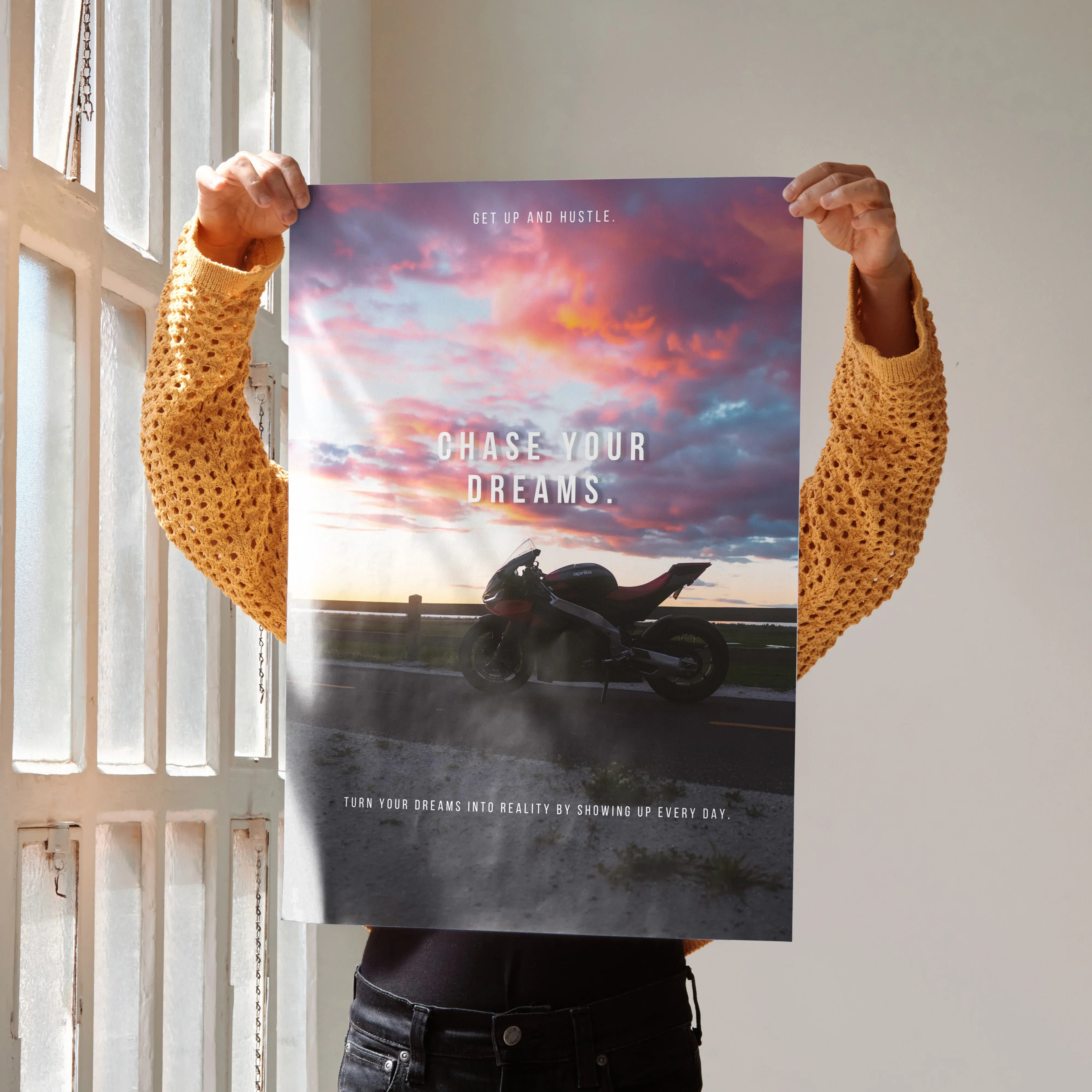 Motivational poster wall art with Aprilia RSV4 1100 Factory bike silhouette against a colorful sunset sky.
