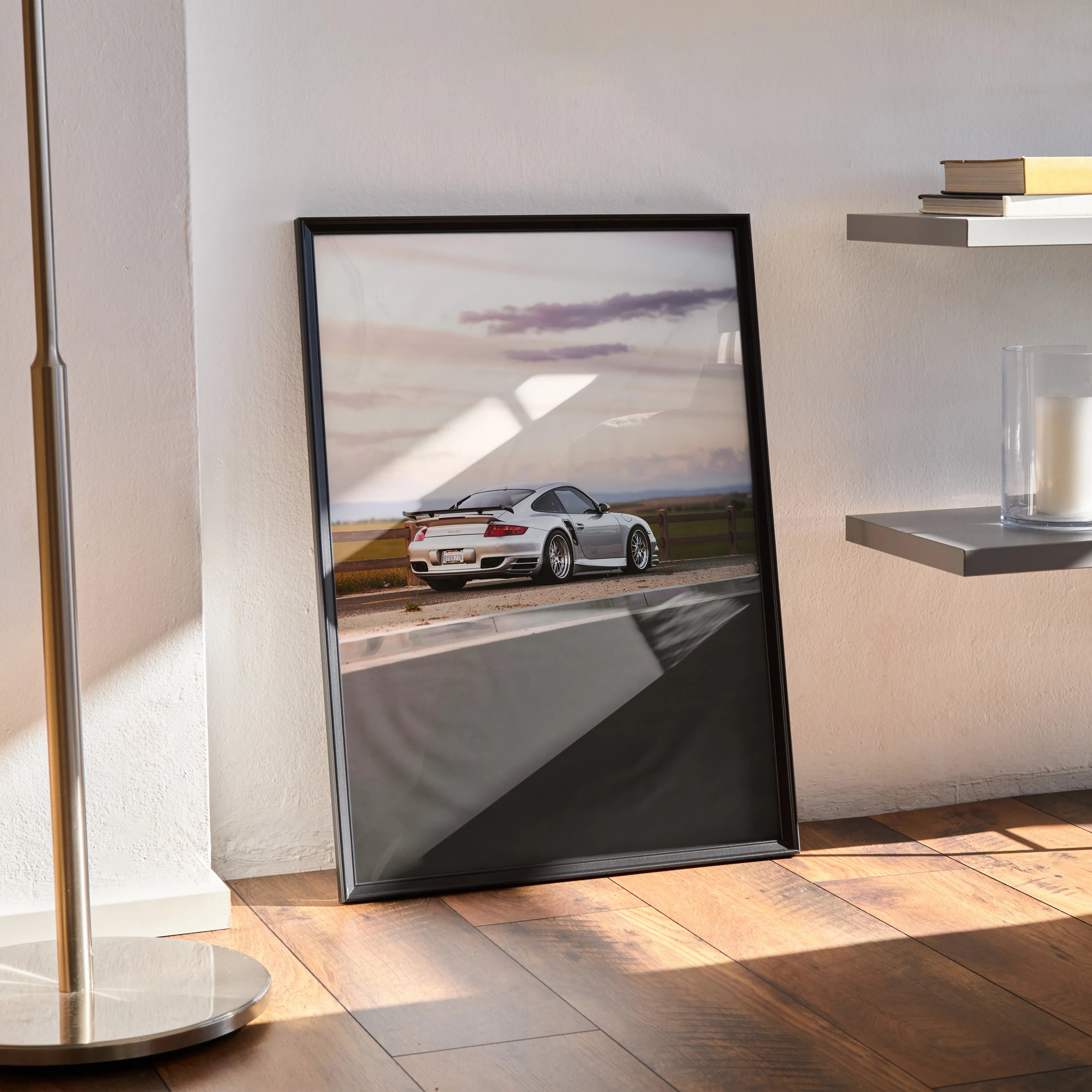 Porsche 911 Turbo poster featuring sleek white sports car on racetrack, modern wall art in black frame.