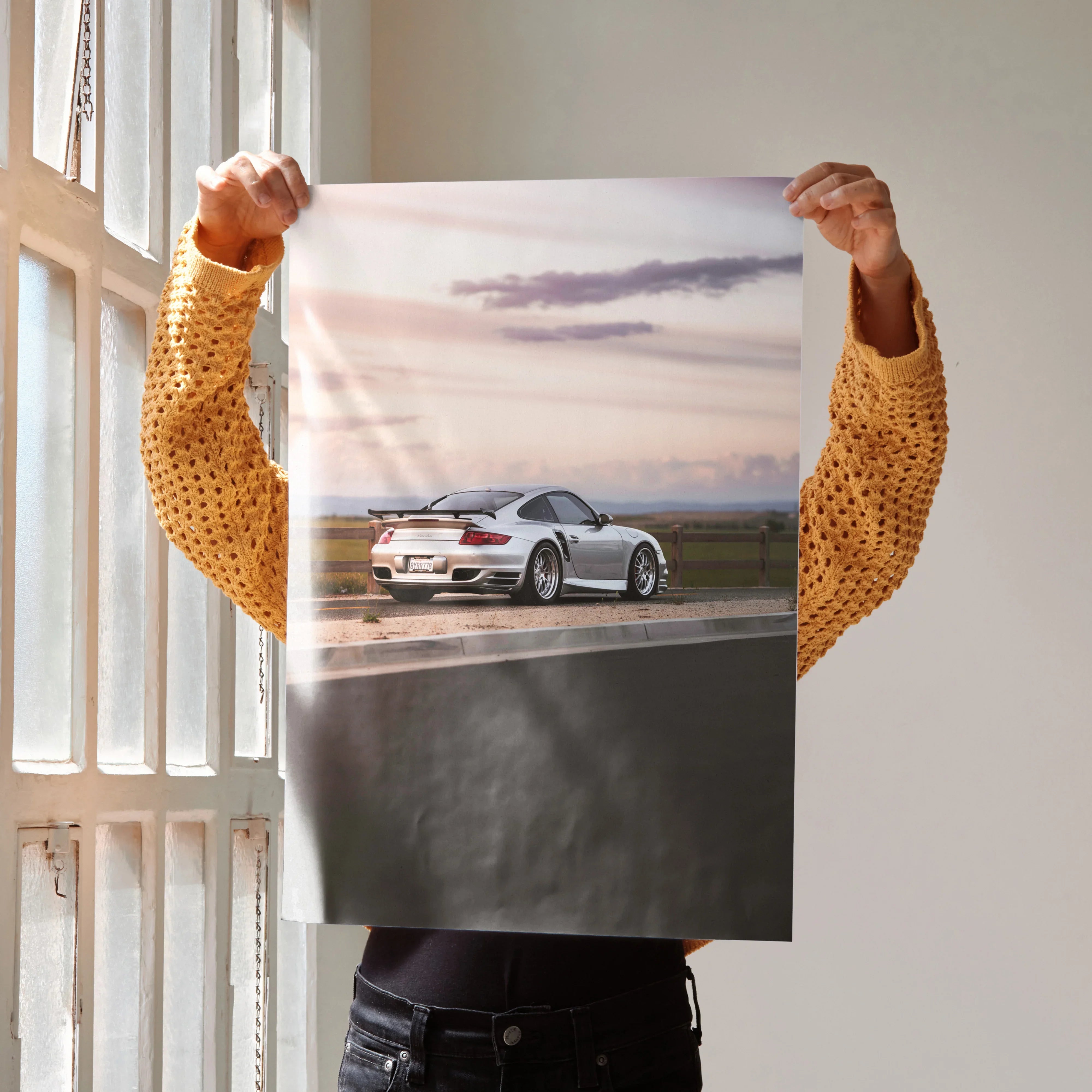Porsche 911 Turbo Poster showing rear view of silver sports car on road at sunset, luxury wall art.