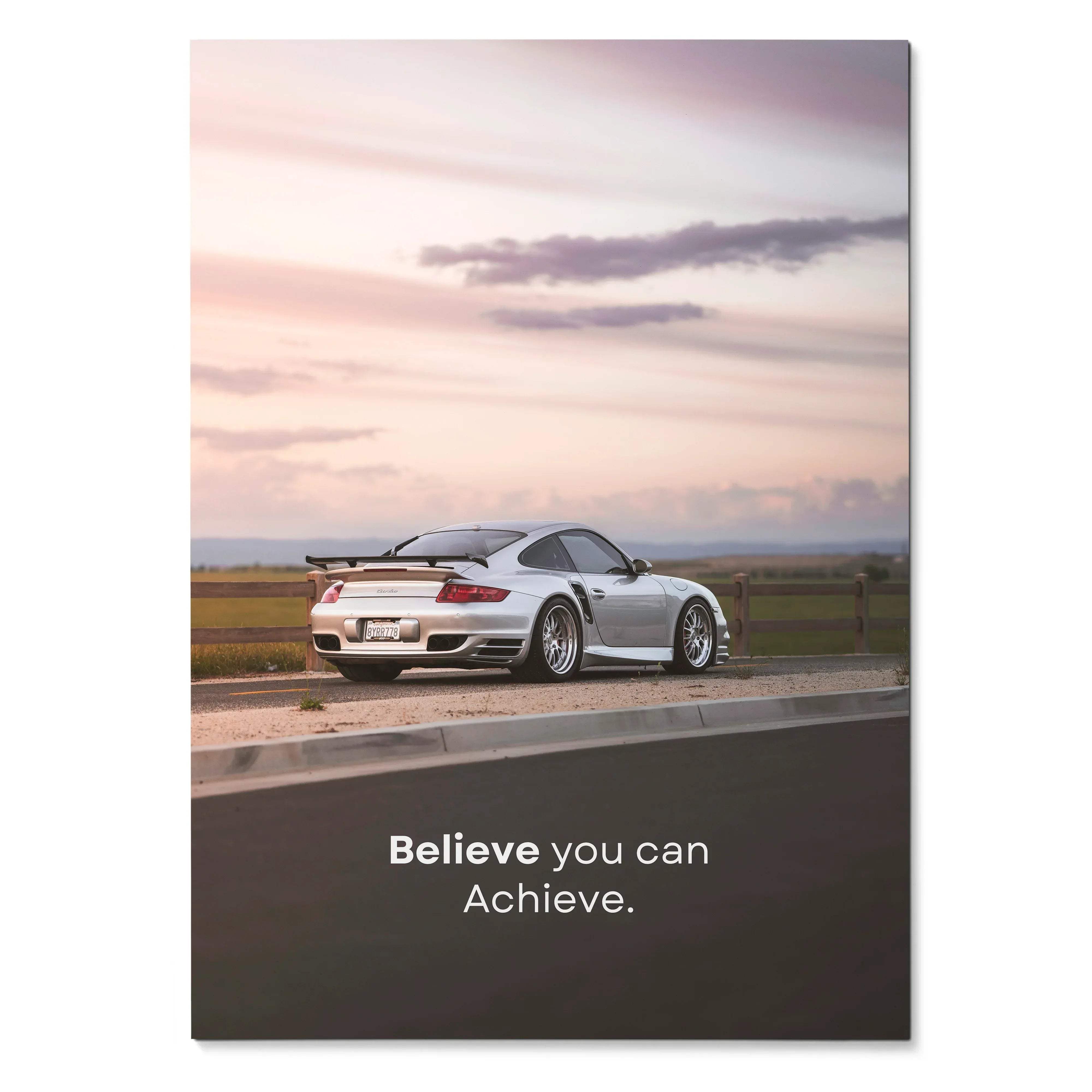 Motivational poster featuring a silver porsche 911 turbo sports car with black racing stripes and aerodynamic design