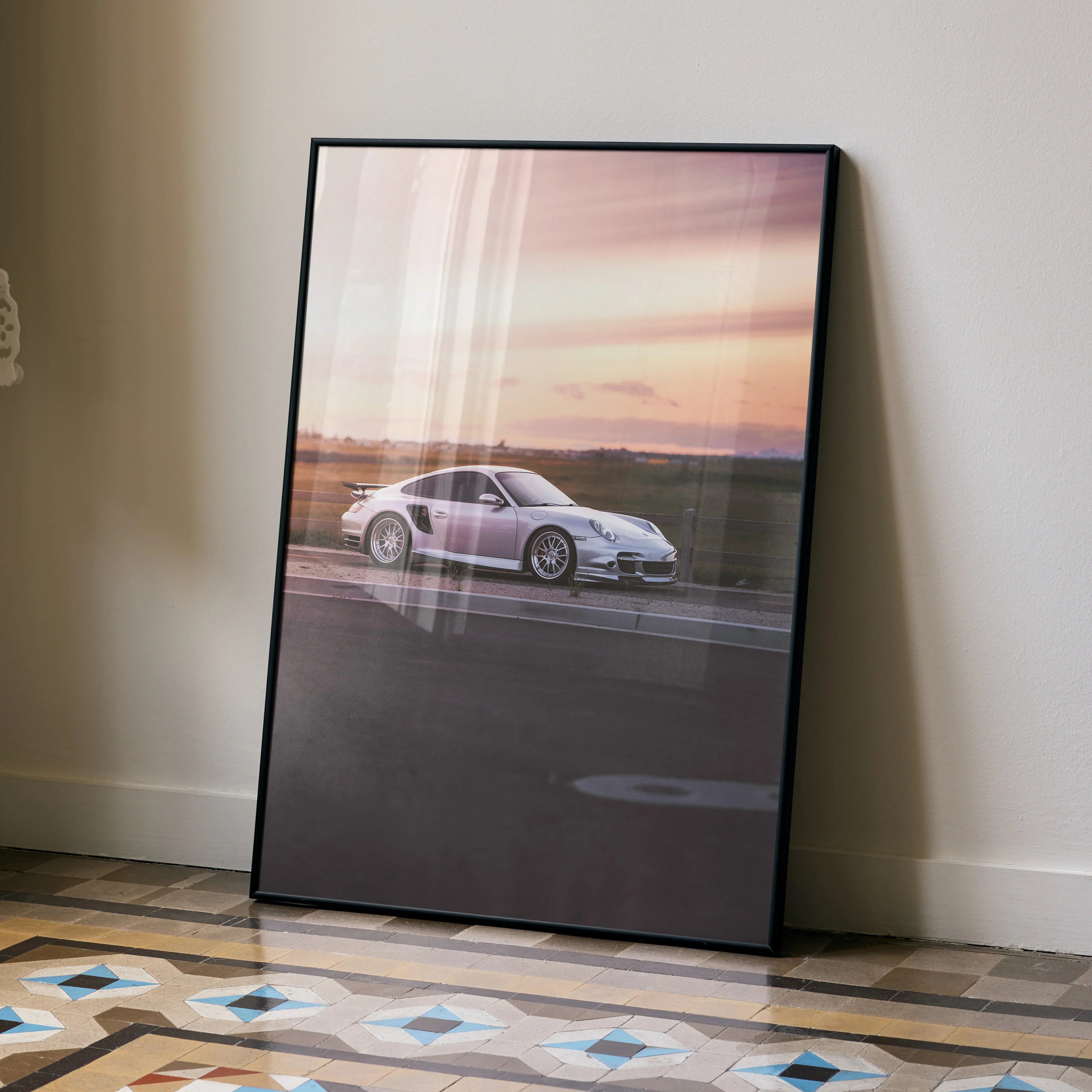 Porsche 911 Turbo poster with sunset backdrop wall art in sleek black frame.