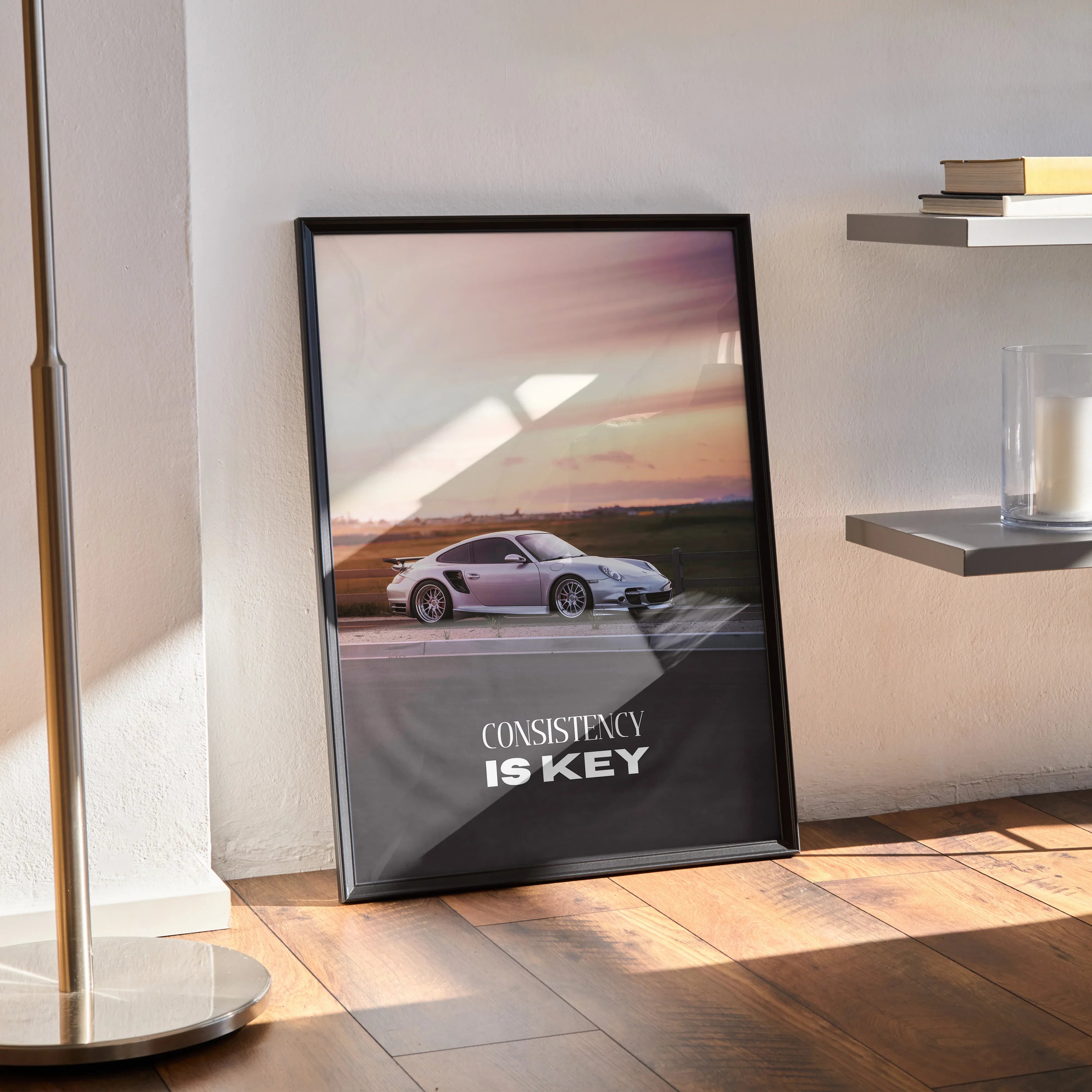 Porsche 911 Turbo motivational poster with "Consistency Is Key" text in black frame wall art.