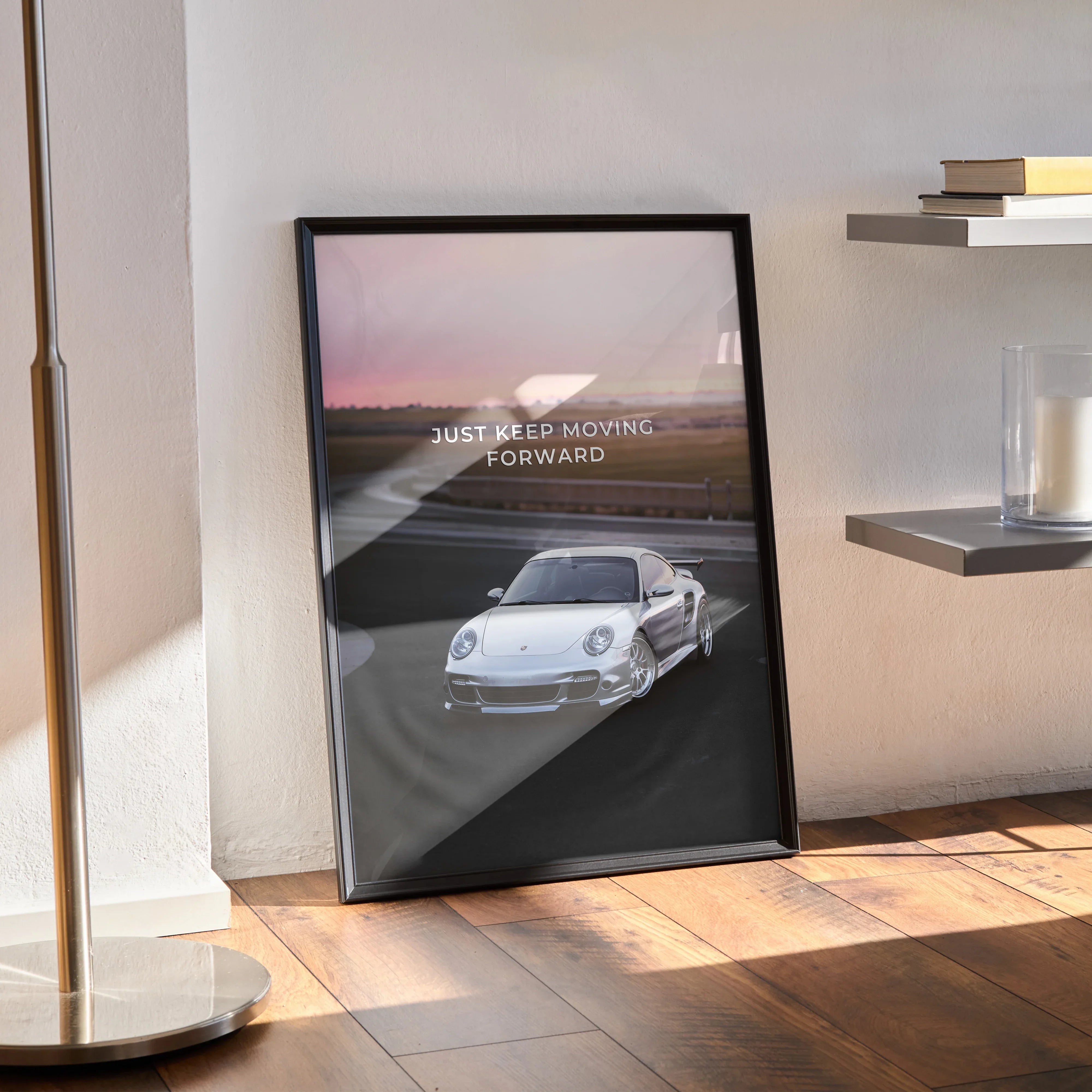 Motivational poster wall art featuring a white Porsche 911 Turbo on a racetrack with sunrise background and inspiring text.