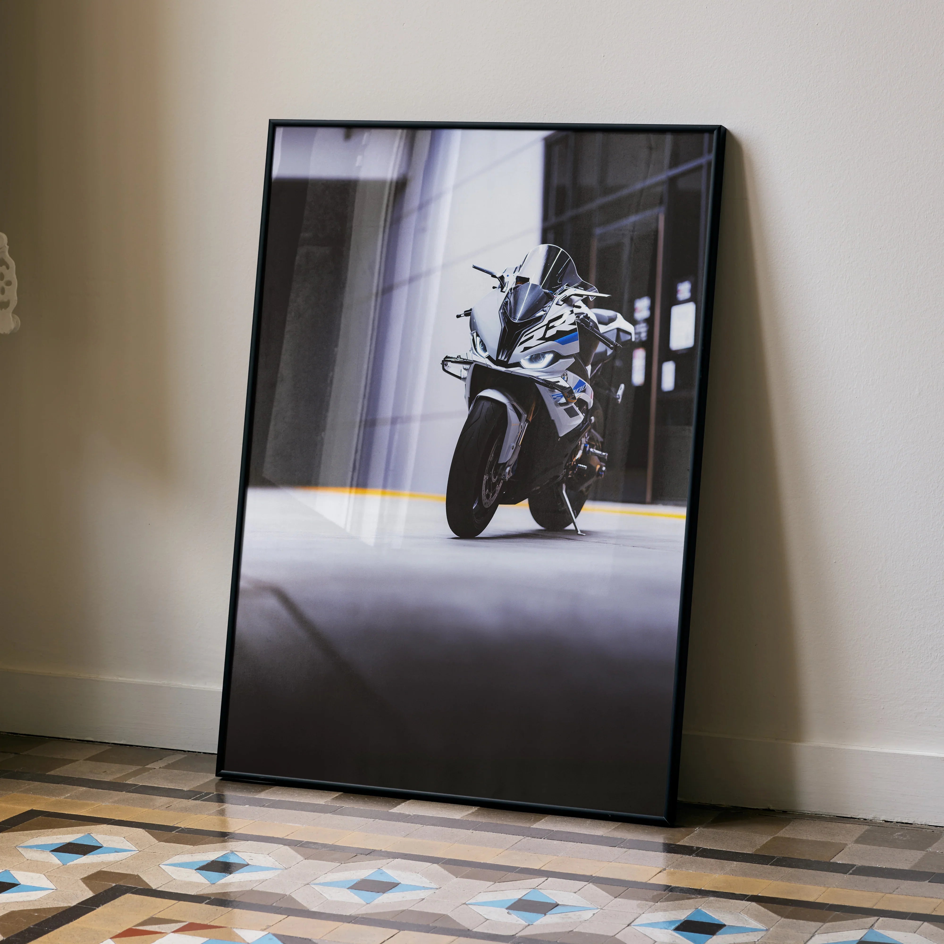 BMW S1000RR motorcycle poster with sleek black frame leaning against wall, modern wall art.