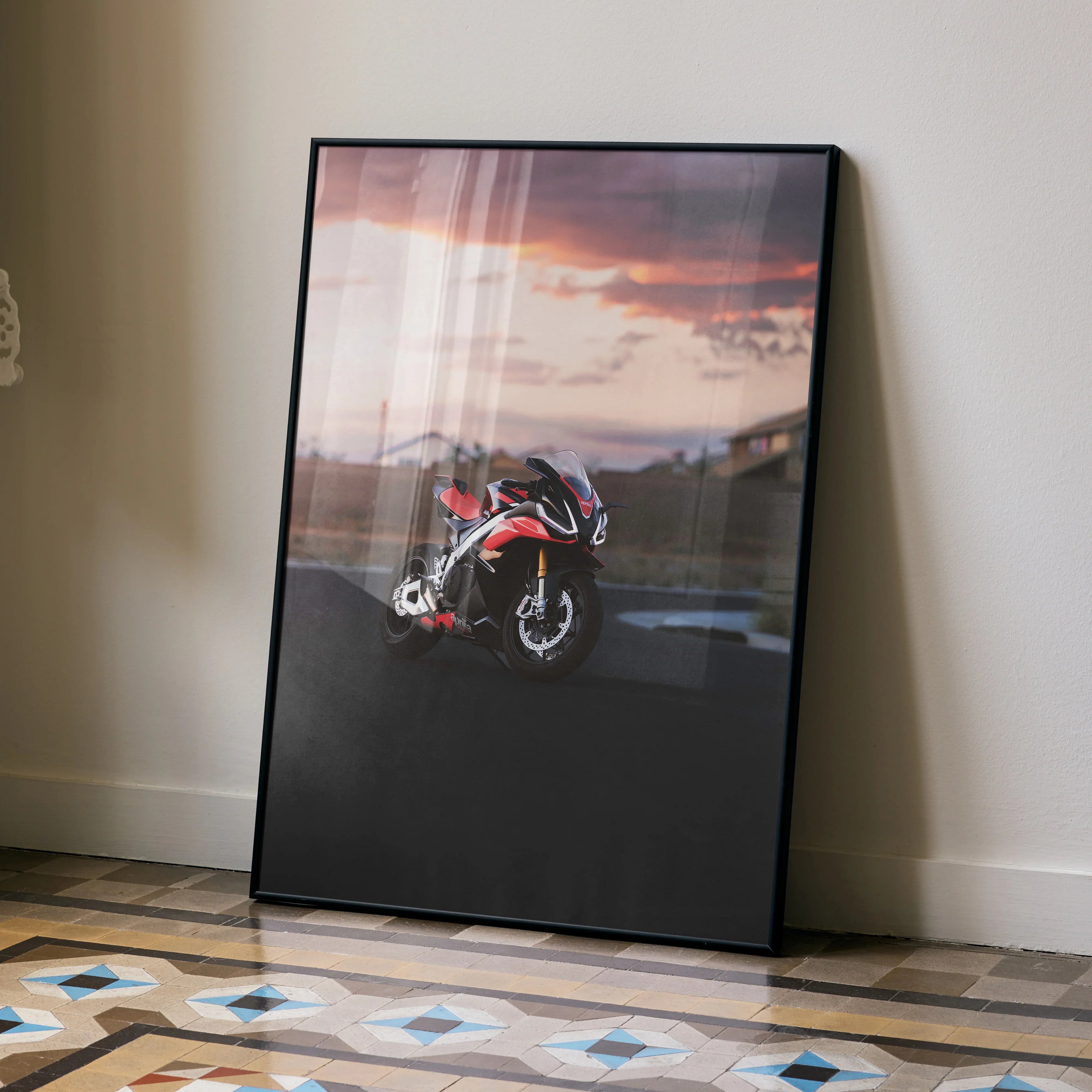 Aprilia RSV4 1100 Factory motorcycle poster with sunset background wall art in black frame.