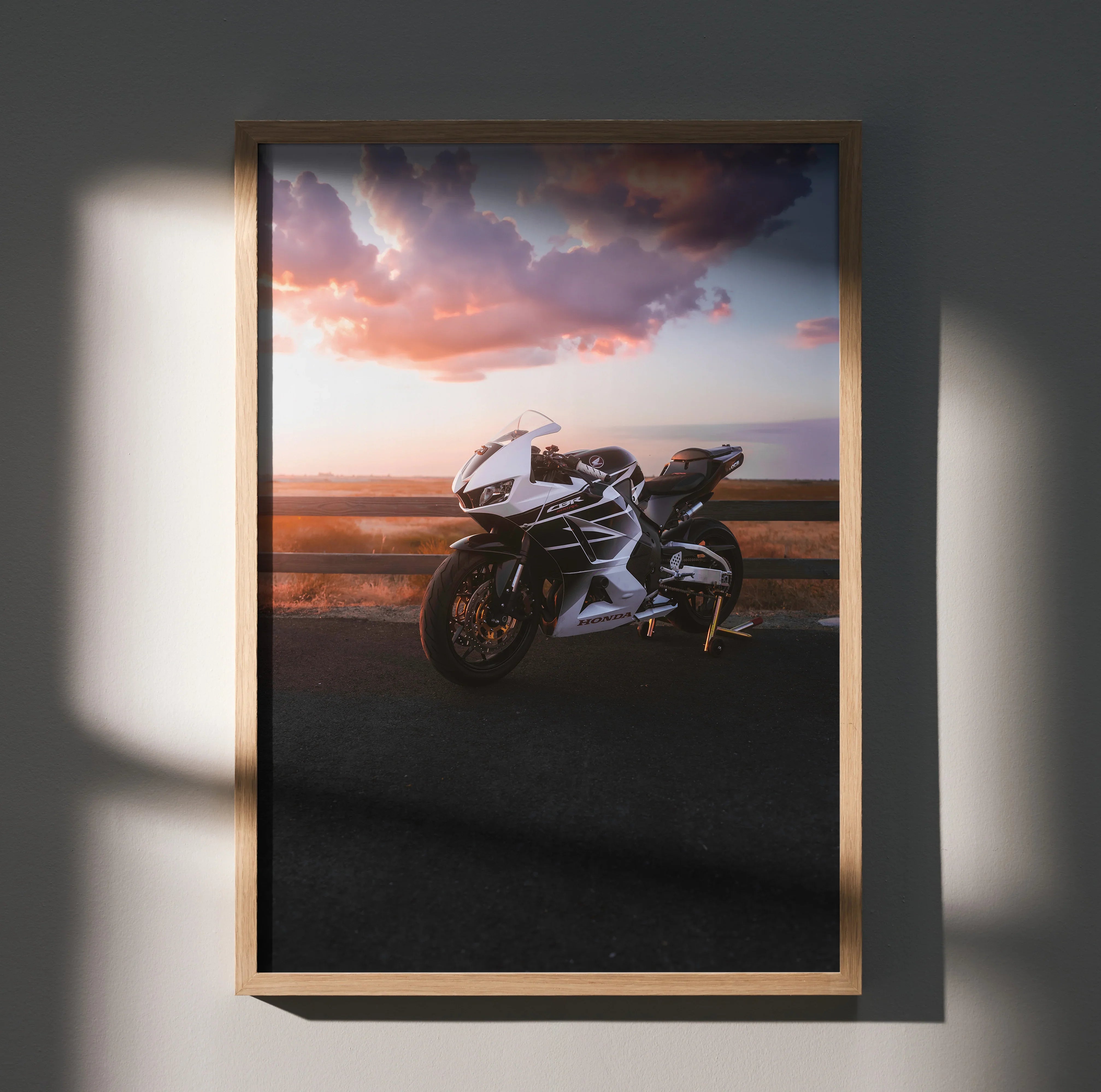 Honda CBR600RR motorcycle poster with sunset sky, sleek design wall art in wooden frame.