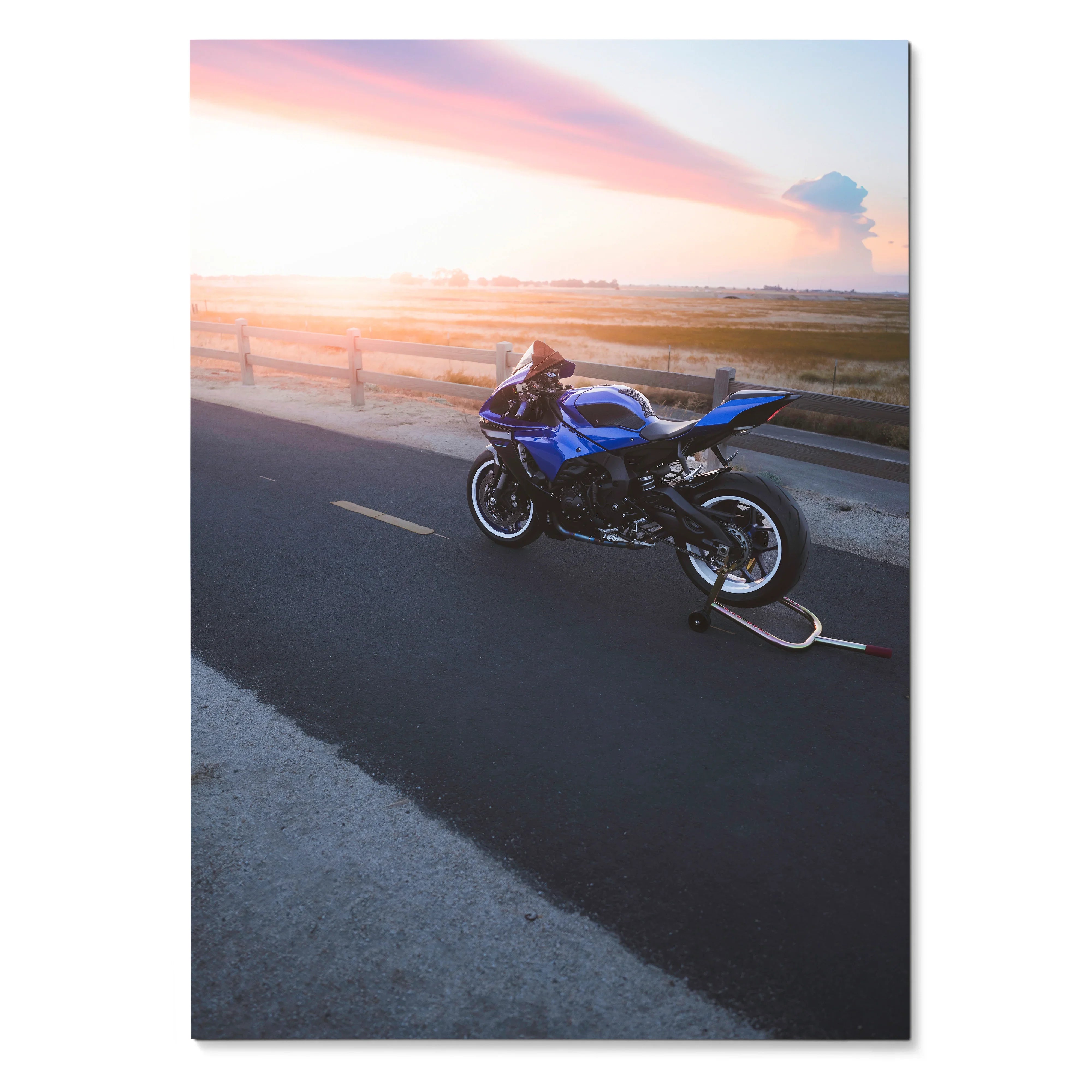YZF-R1 Yamaha motorcycle parked on road at sunset poster wall art with pink sky.