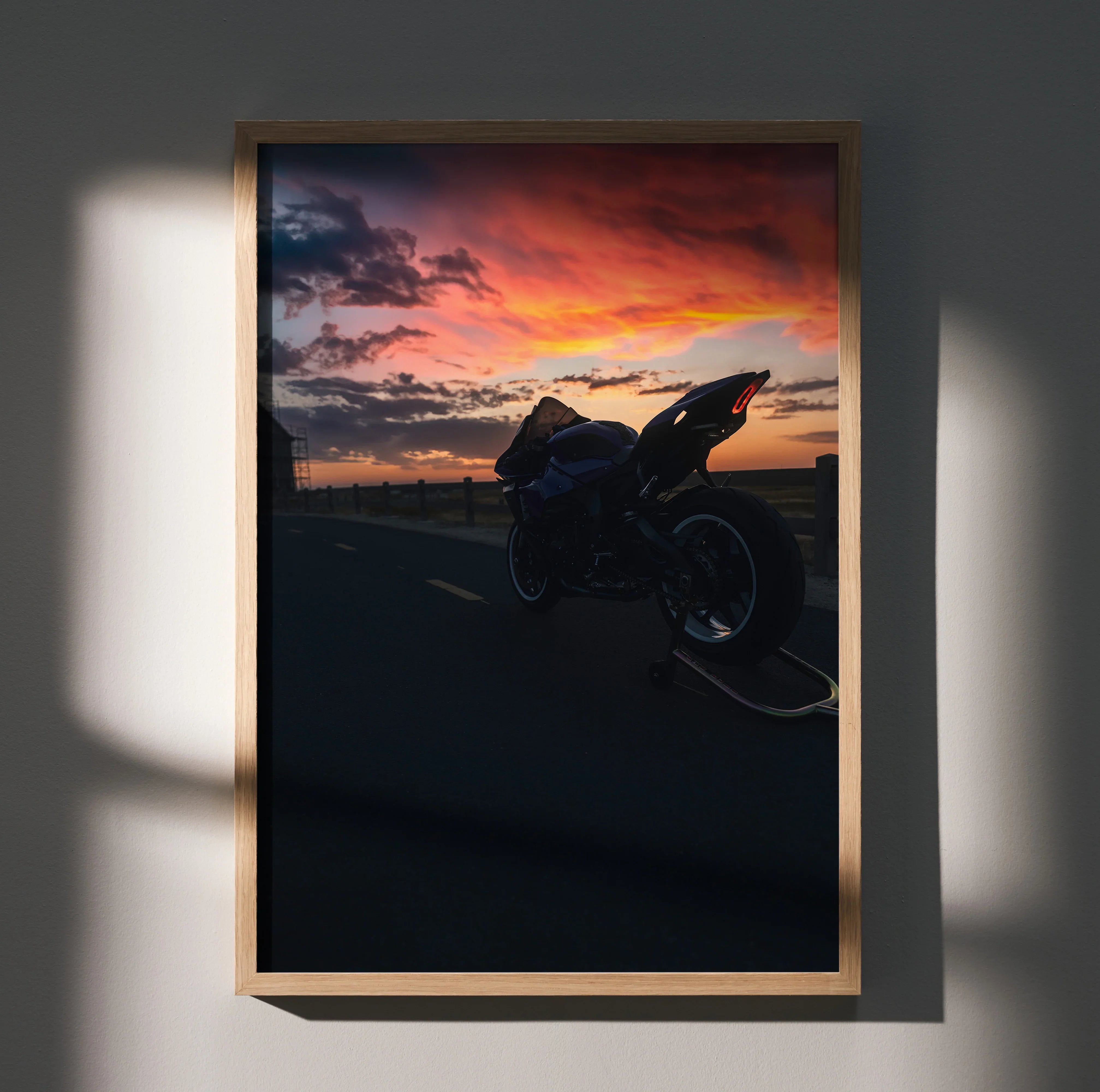 Yamaha R1 motorcycle silhouette against vibrant sunset sky poster wall art in wooden frame.
