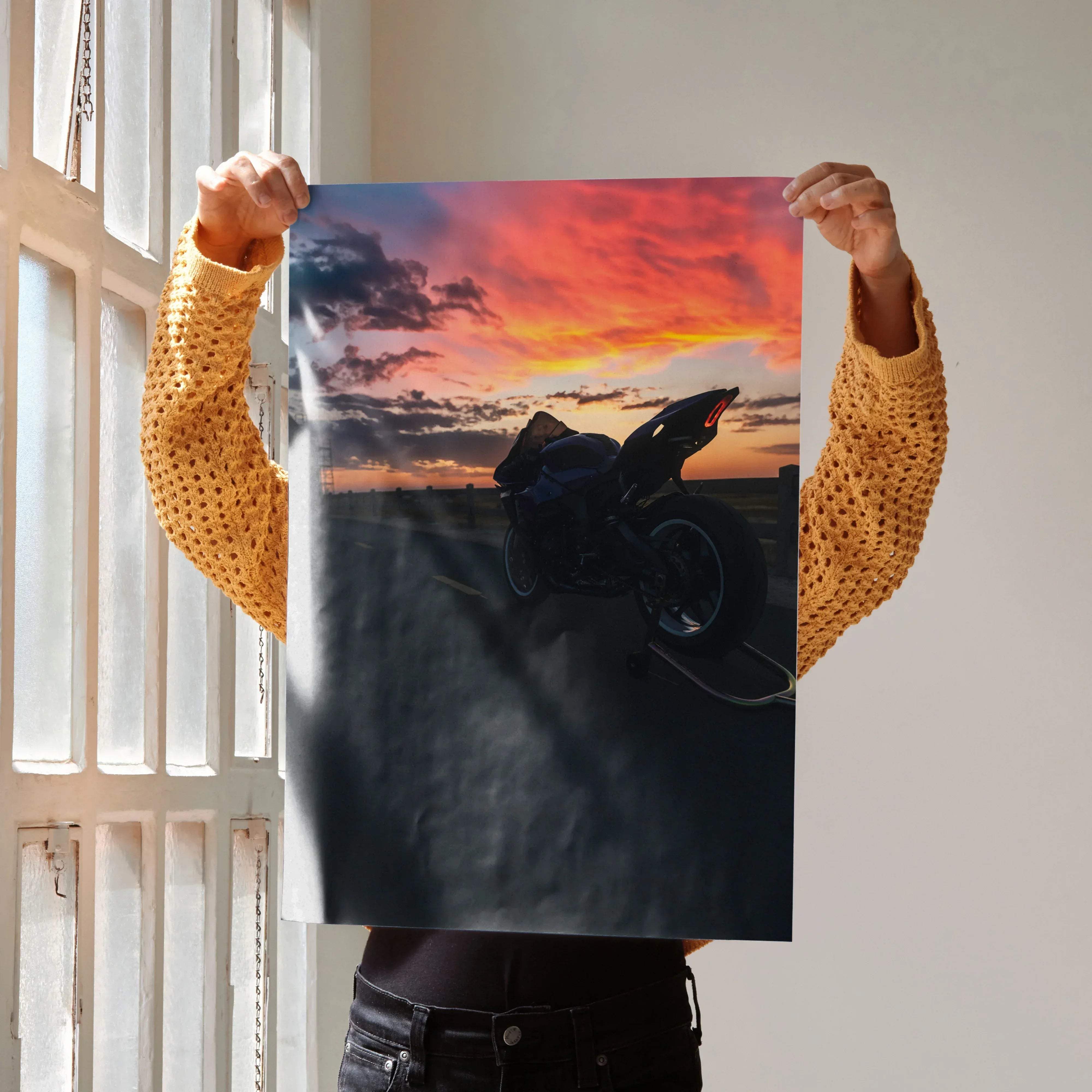 A vibrant Yamaha R1 motorcycle art poster featuring a sleek black sportbike against fiery orange and pink clouds