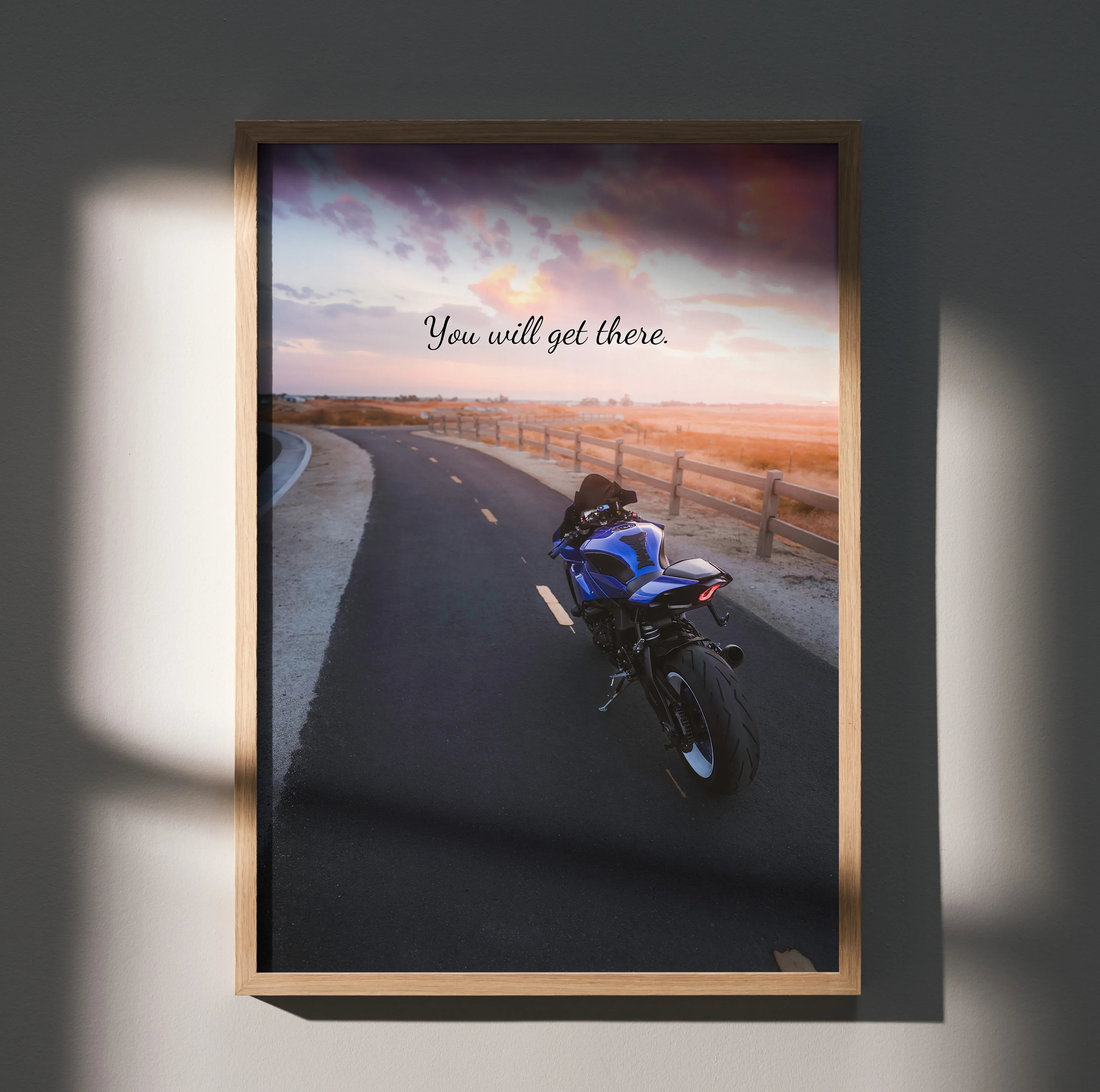 Motivational poster wall art featuring blue Yamaha R1 motorcycle on sunset road with "You will get there" text.