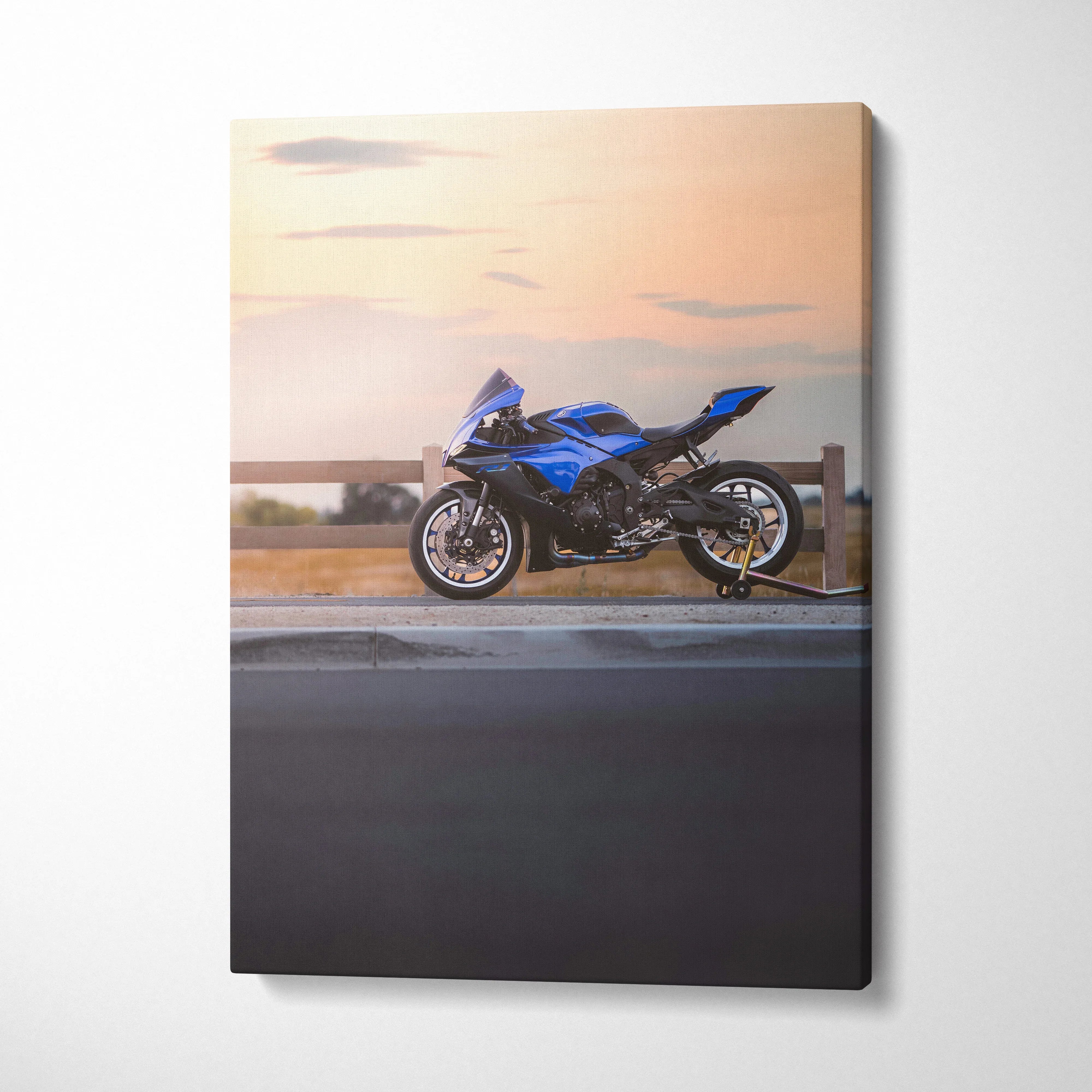 Yamaha R1 motorcycle in blue against sunset backdrop vertical canvas wall art.