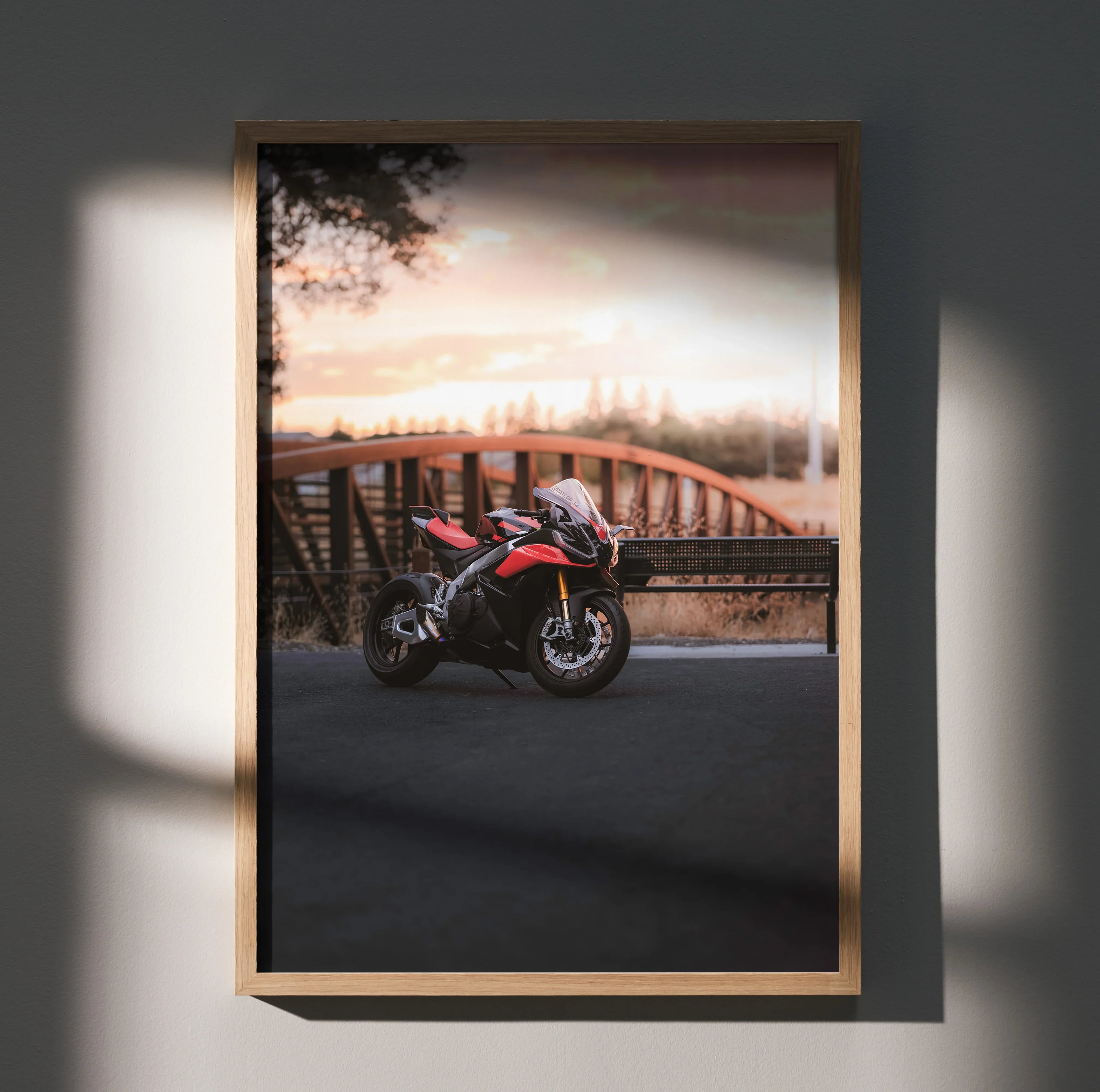 Aprilia RSV4 1100 Factory motorcycle poster with sunset and bridge wall art in warm tones.